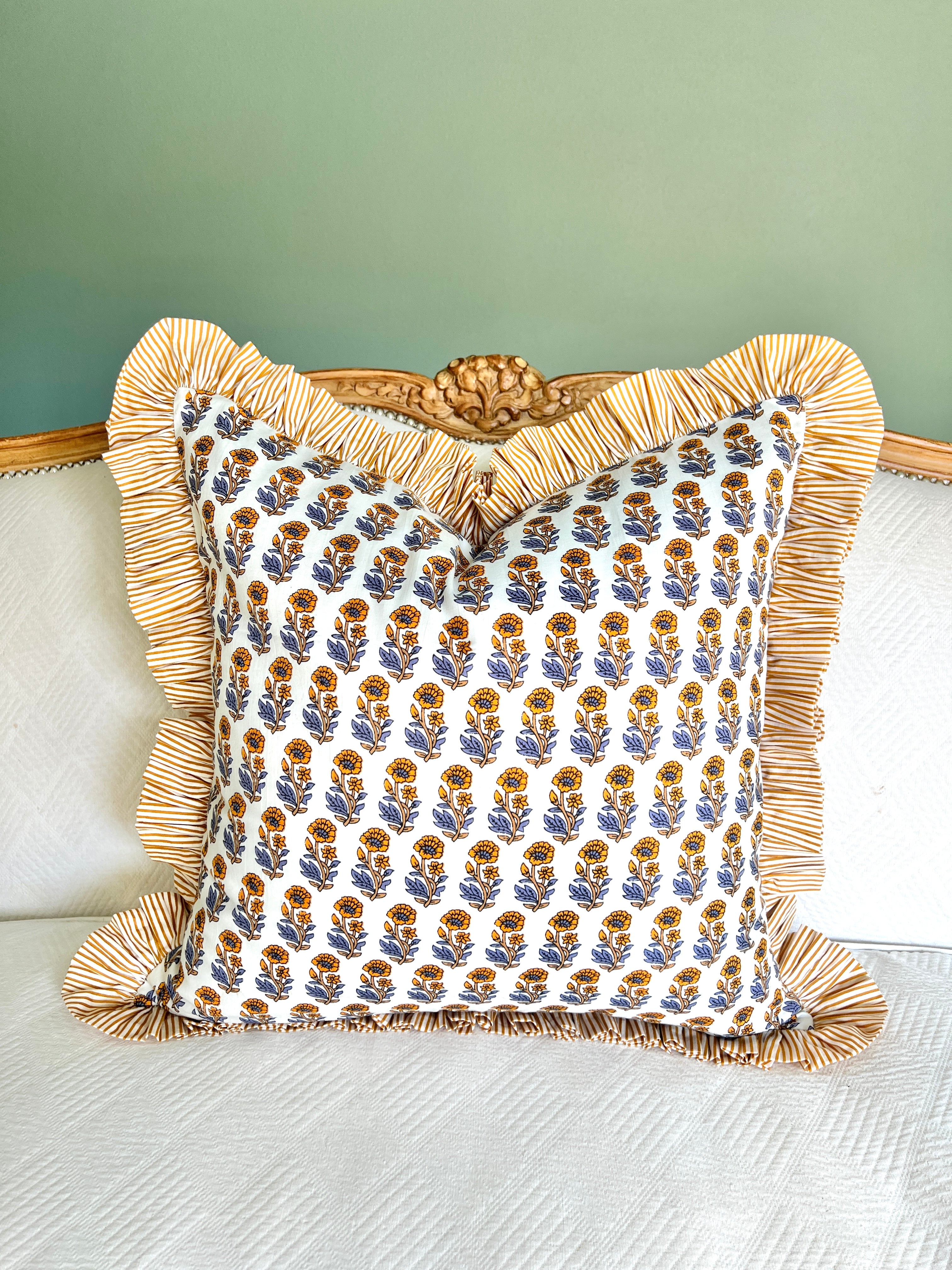 Yellow and blue block print pillow cover with striped contrast ruffle