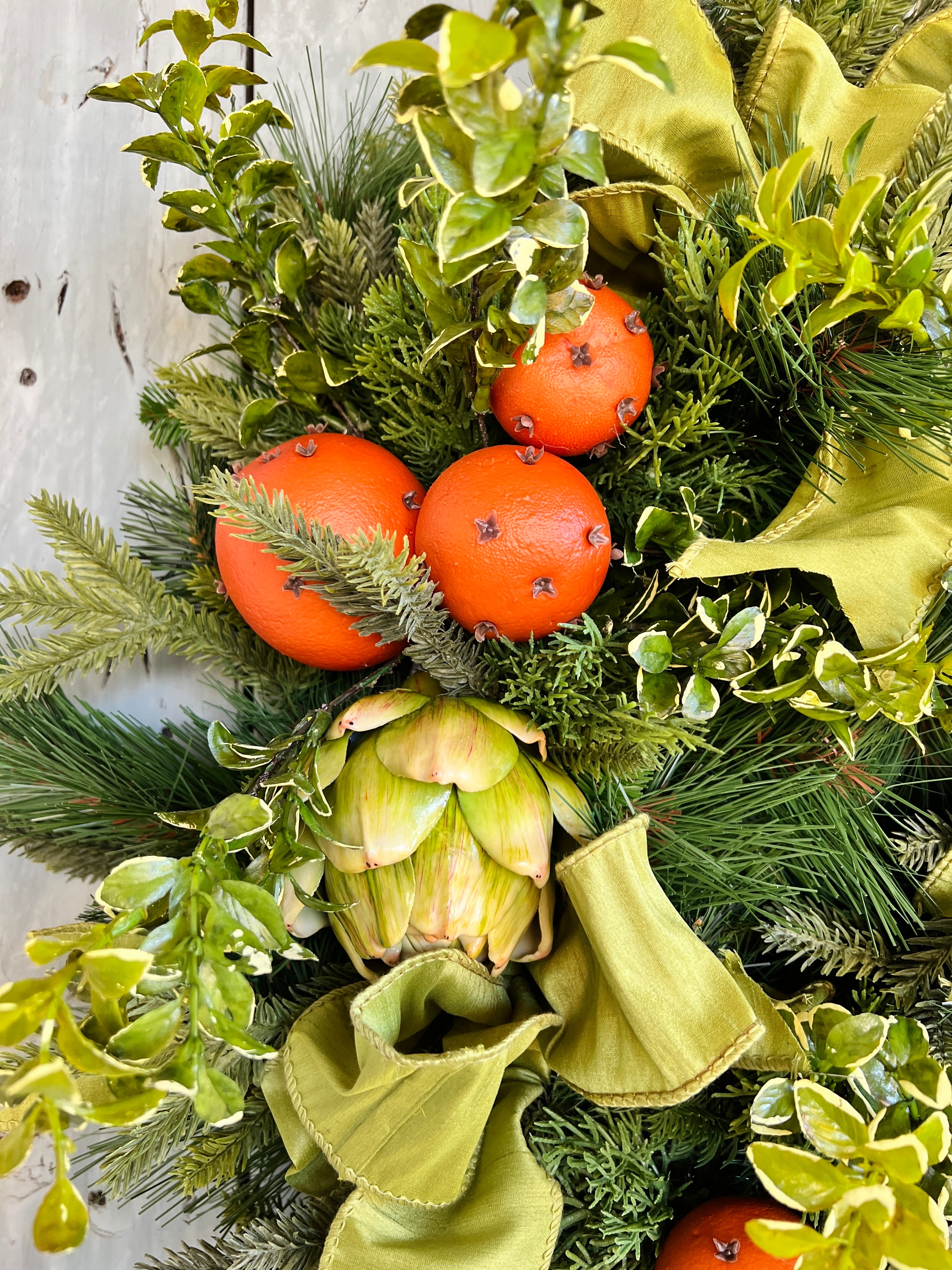 Orange pomander and artichoke wreath