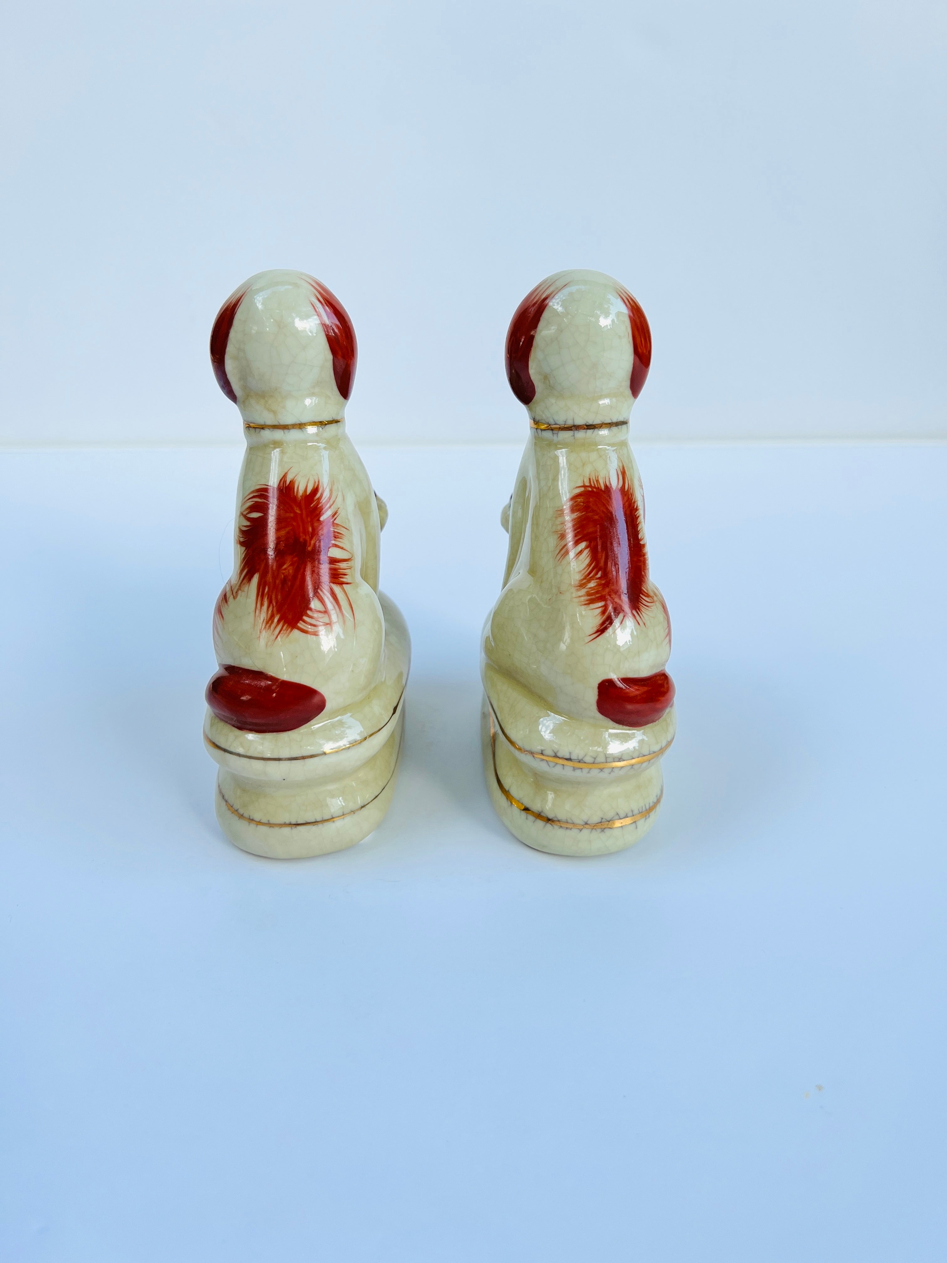 Staffordshire dog pair with flower baskets rust