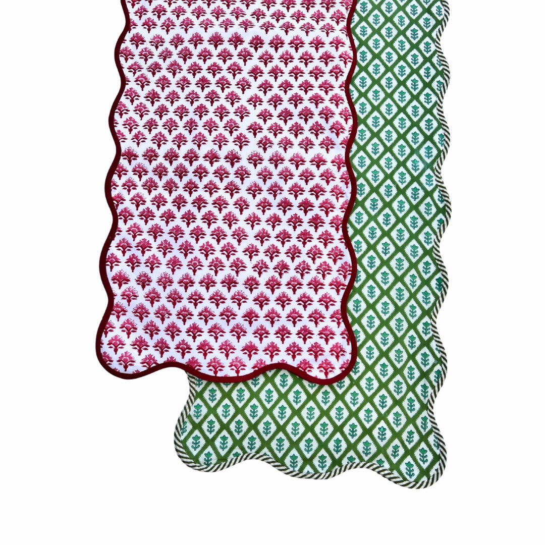 Green block print scalloped table runner with contrast piping