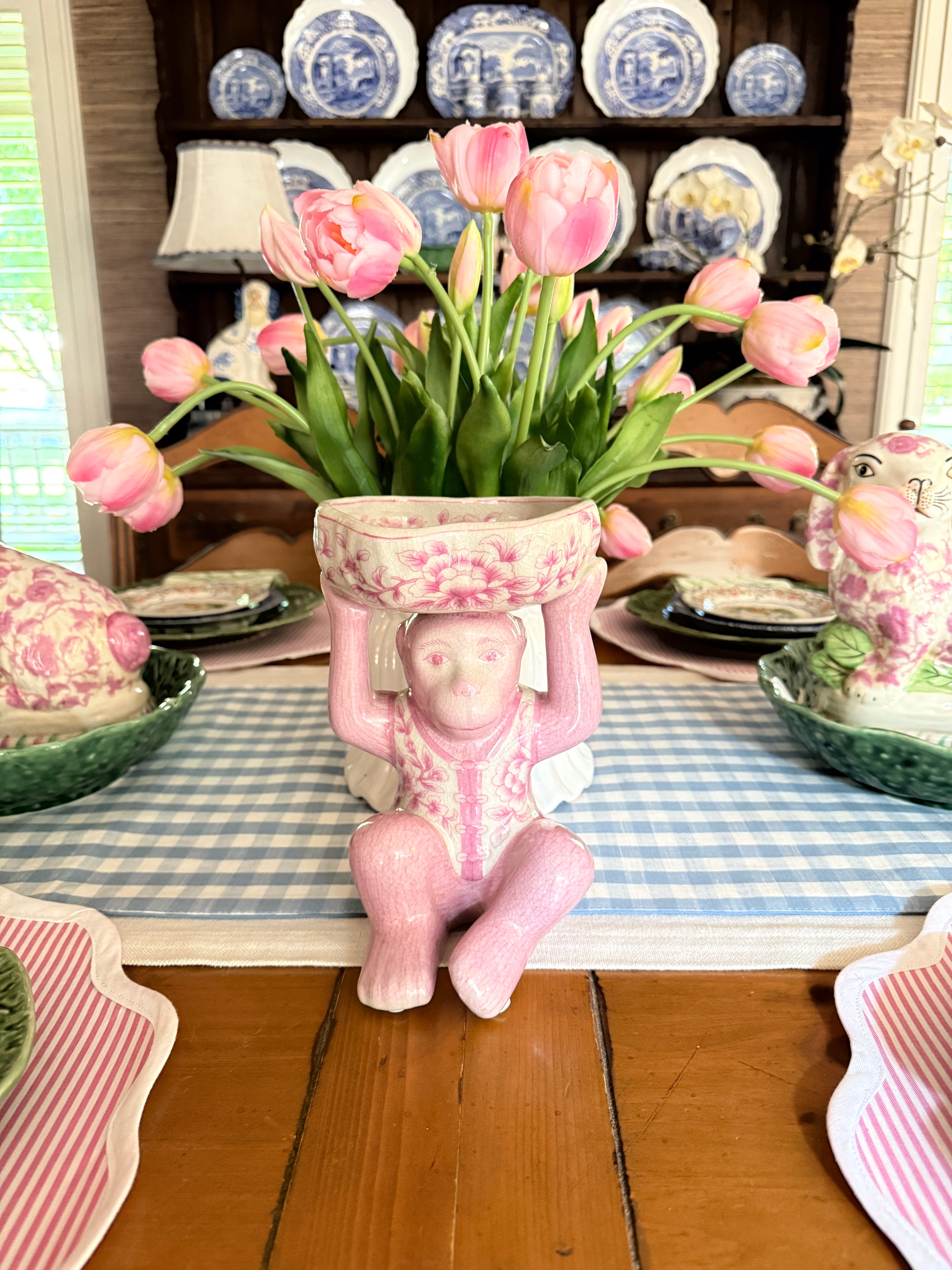 Pink porcelain chinoiserie monkey with lotus bowl