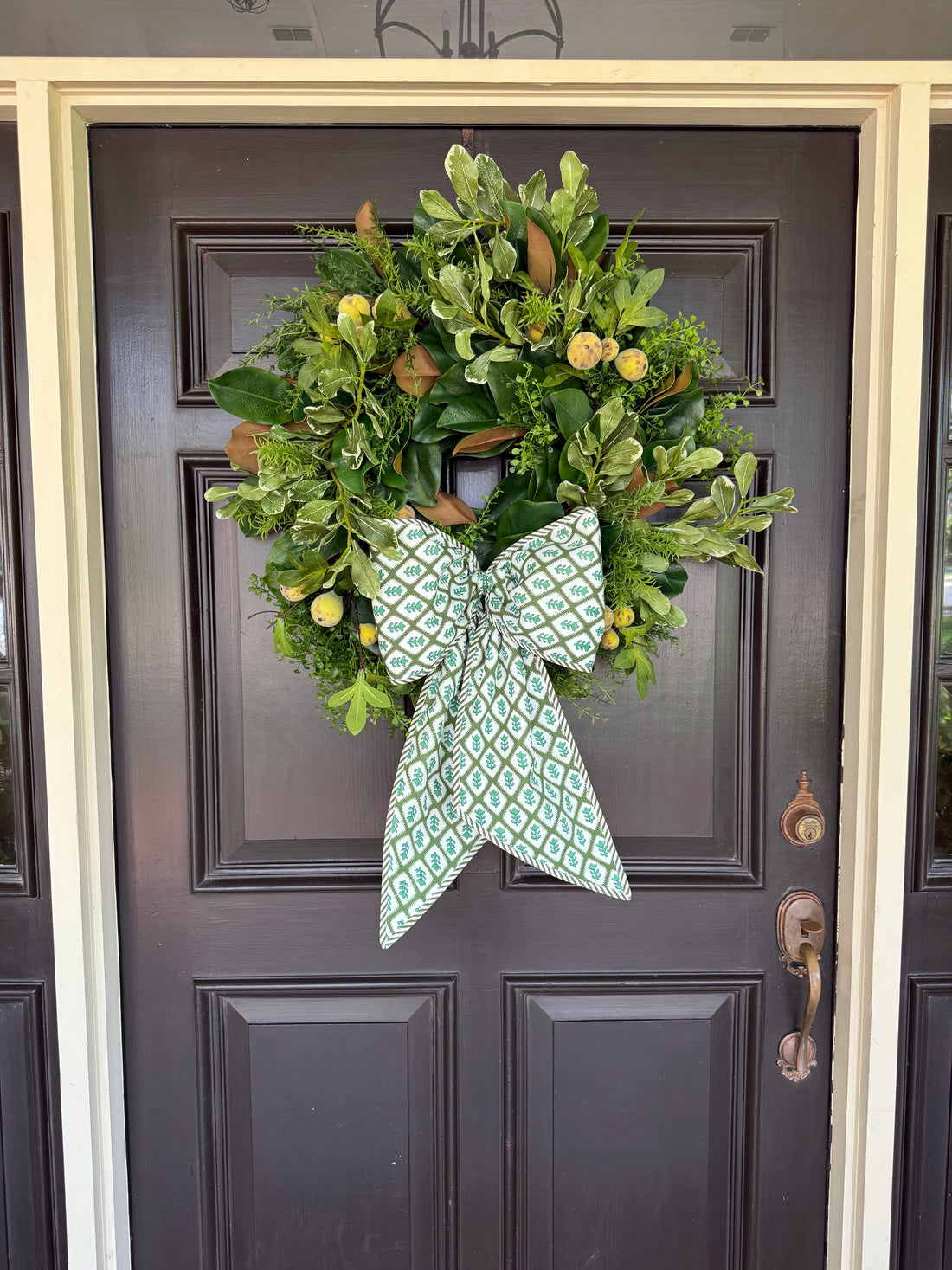 Green block print wreath sash with striped piping