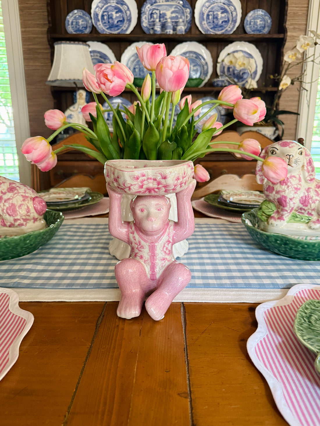 Pink porcelain chinoiserie monkey with lotus bowl