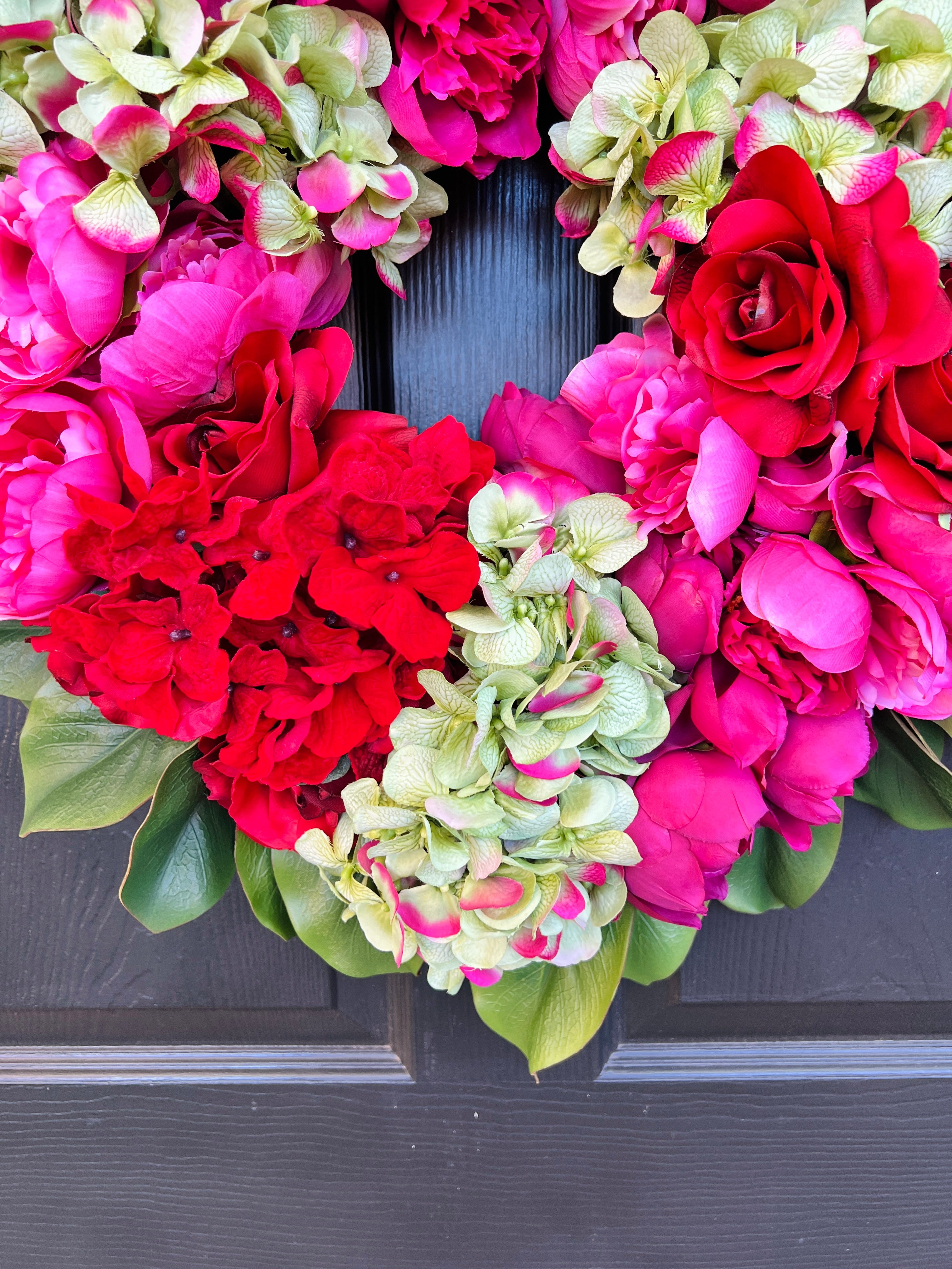 Pink, green, and red floral wreath