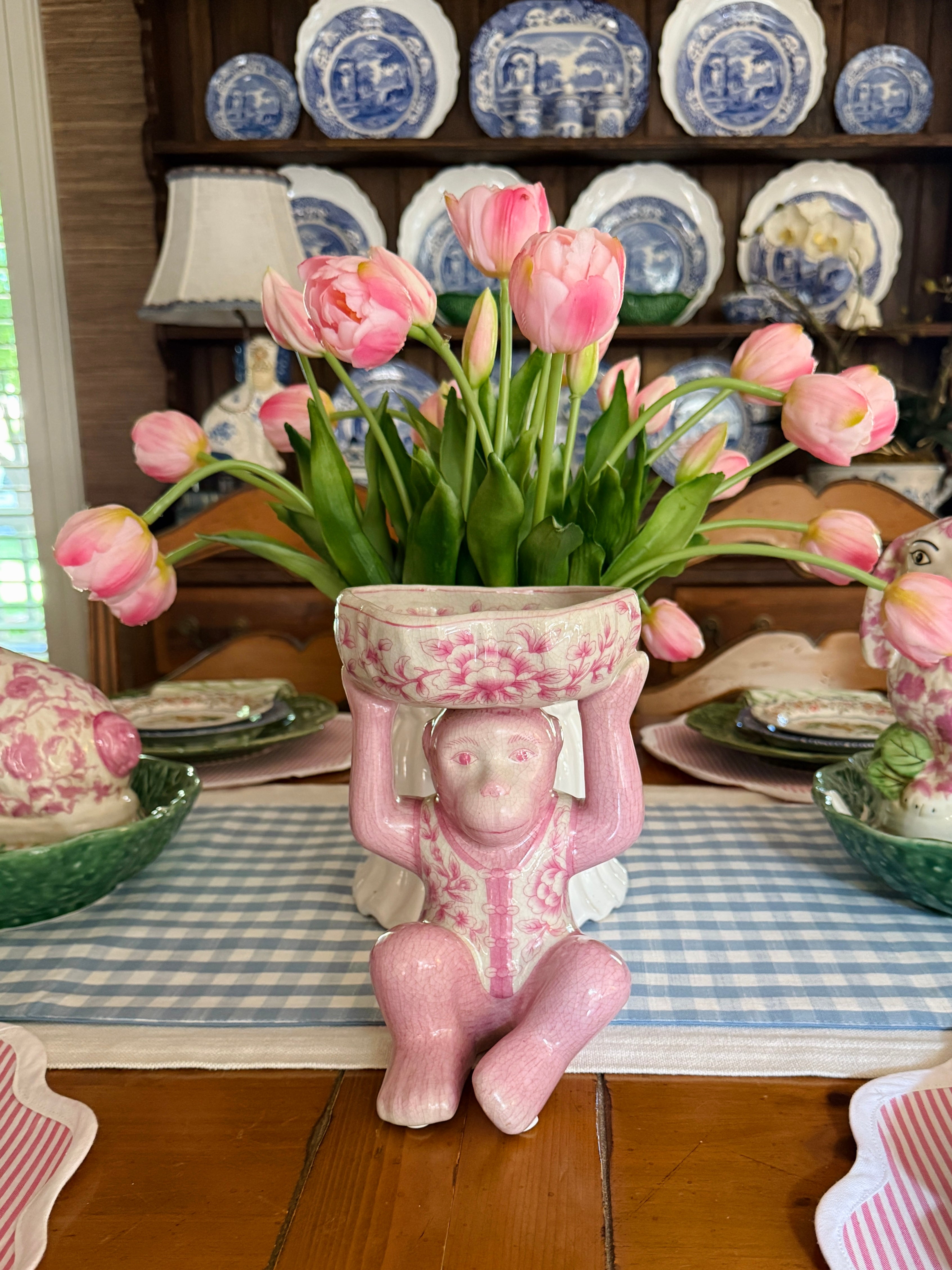 Pink porcelain chinoiserie monkey with lotus bowl