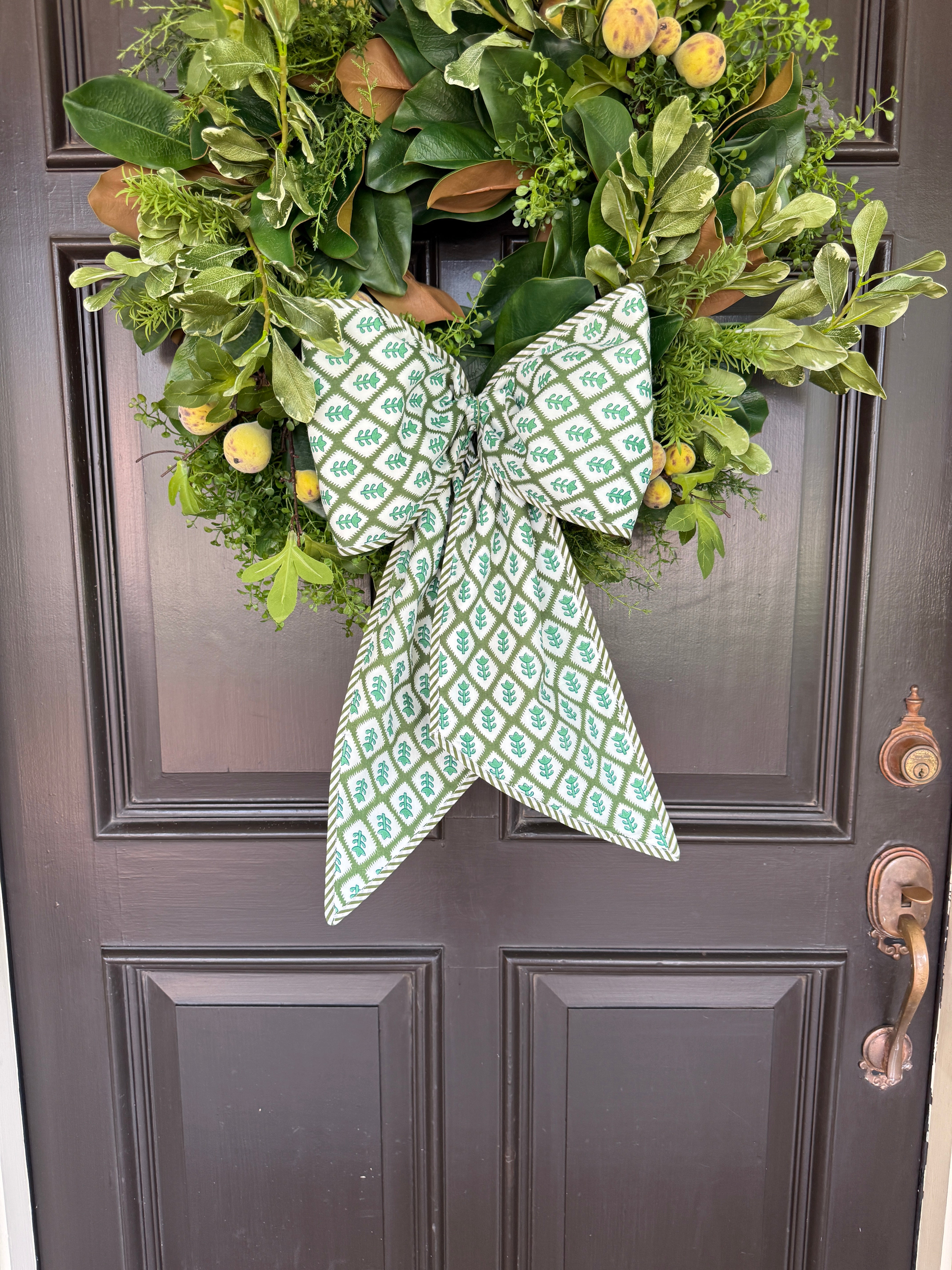 Green block print wreath sash with striped piping – Grace Harris