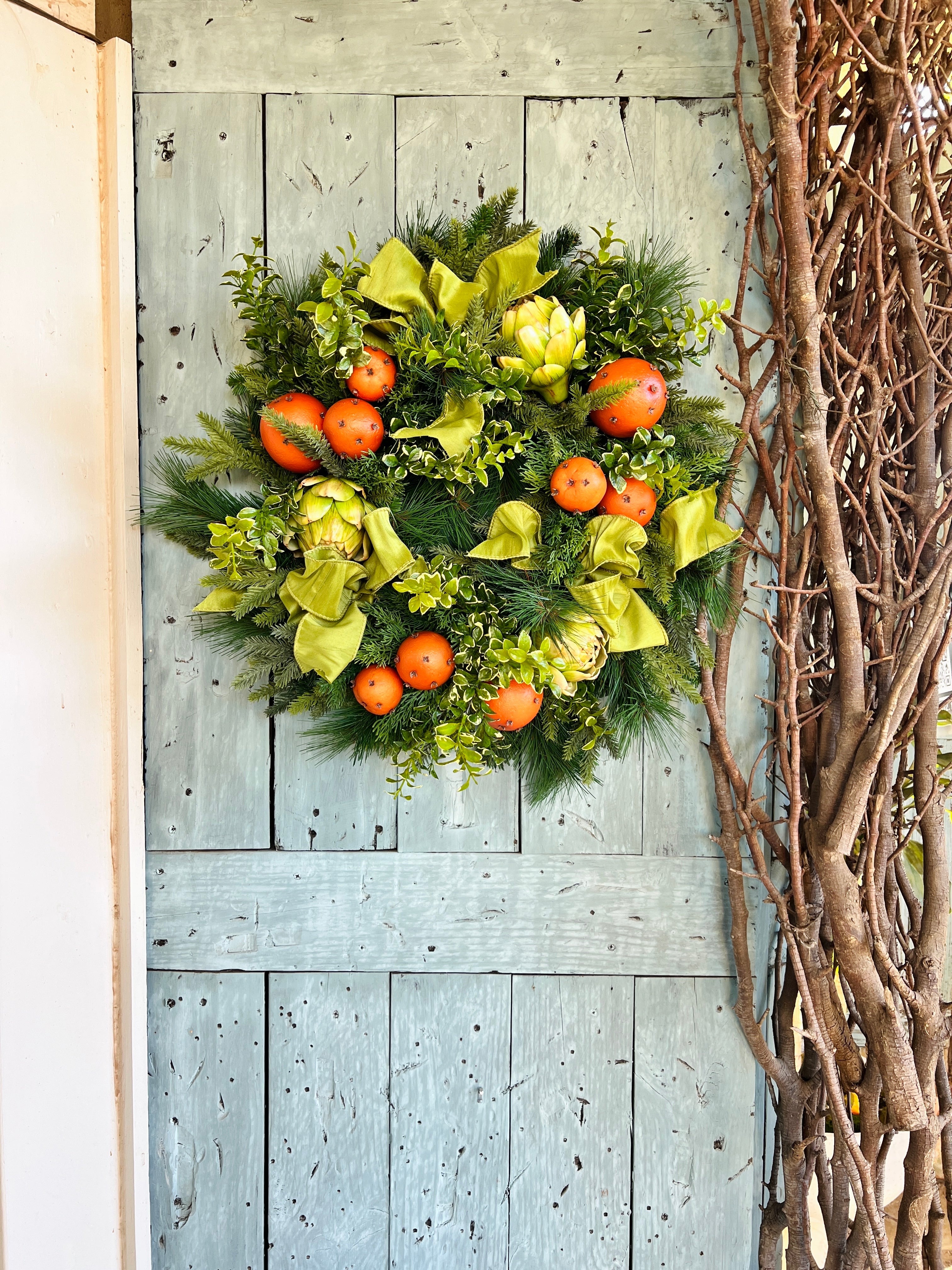 Orange pomander and artichoke wreath