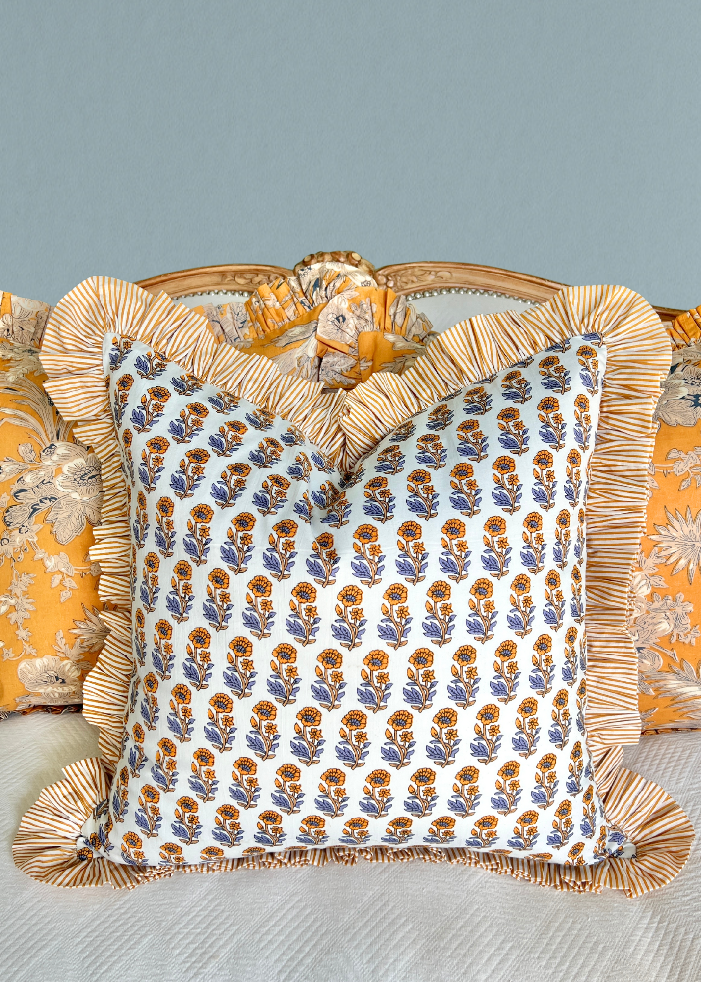Yellow and blue floral block print pillow cover with ruffle trim