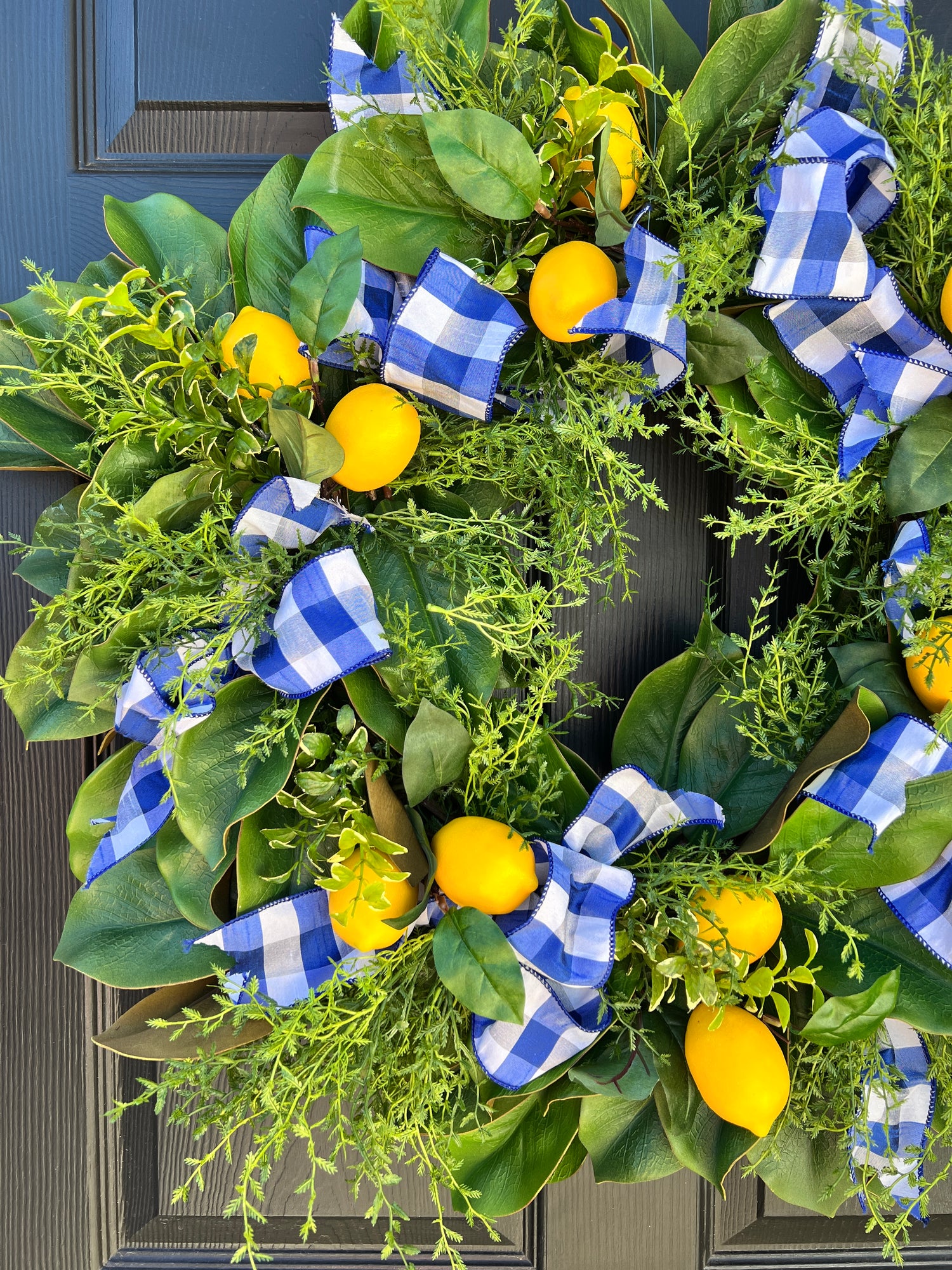 Lemon, herb, and magnolia wreath with blue gingham dupioni ribbon
