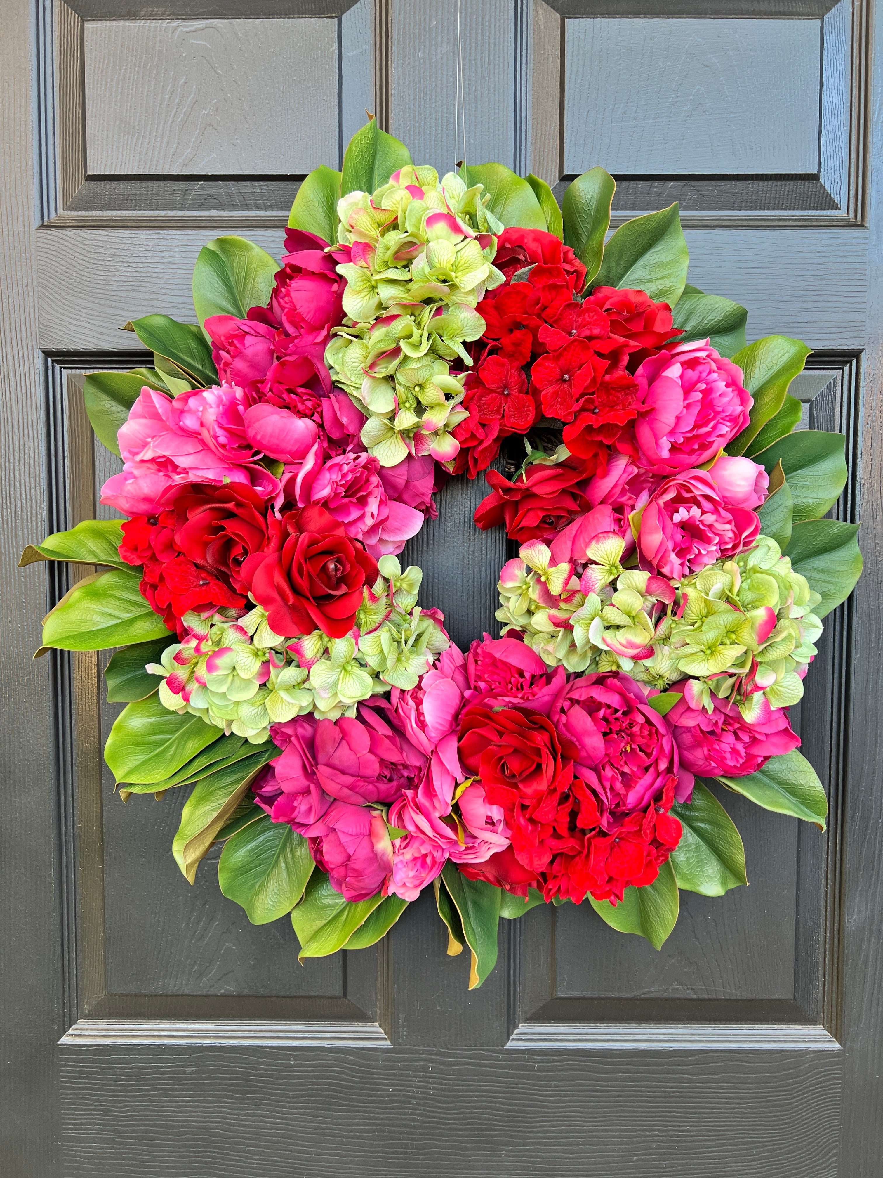 Pink, green, and red floral wreath