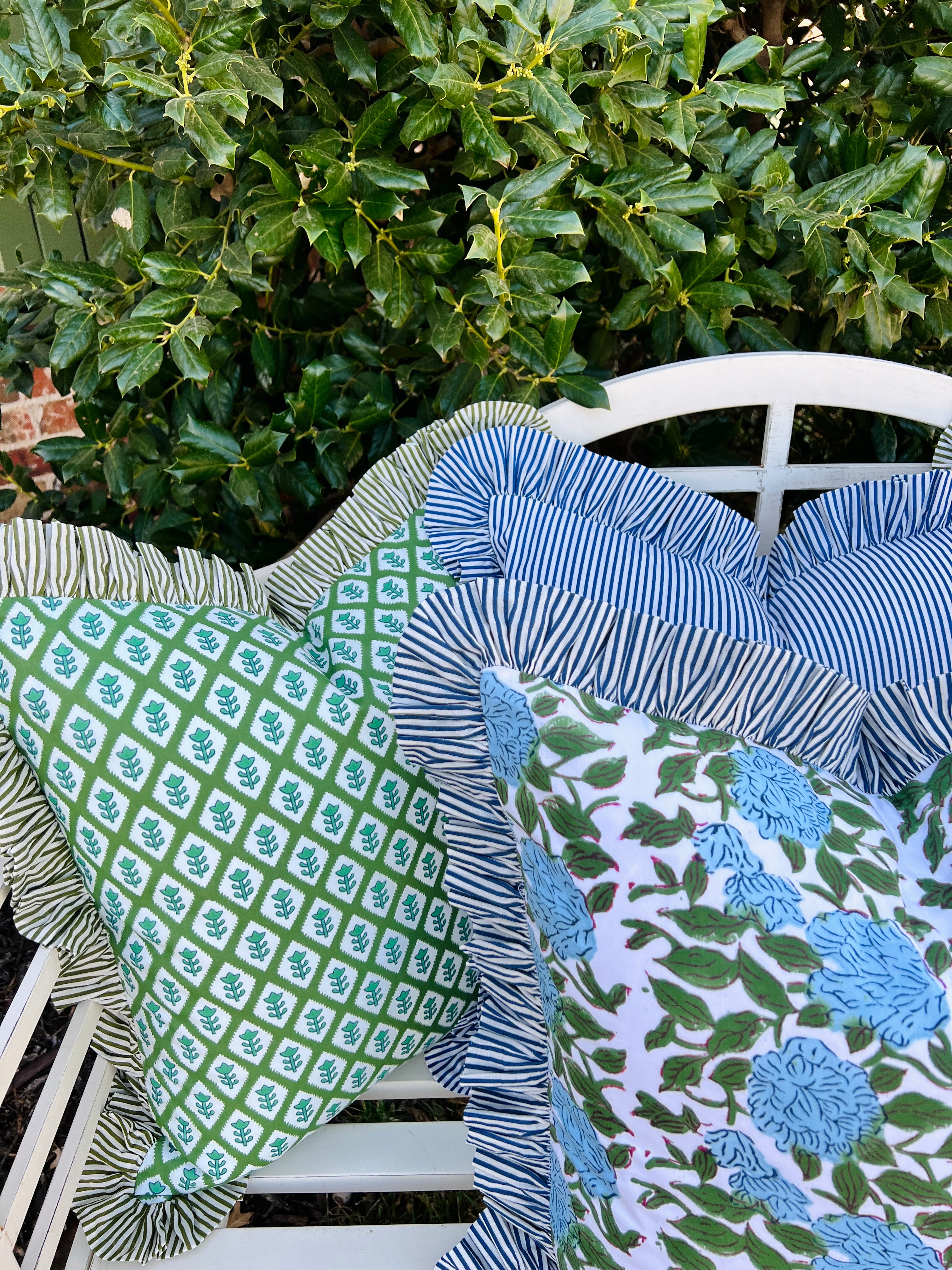 Blue and green floral block print pillow cover with ruffle trim