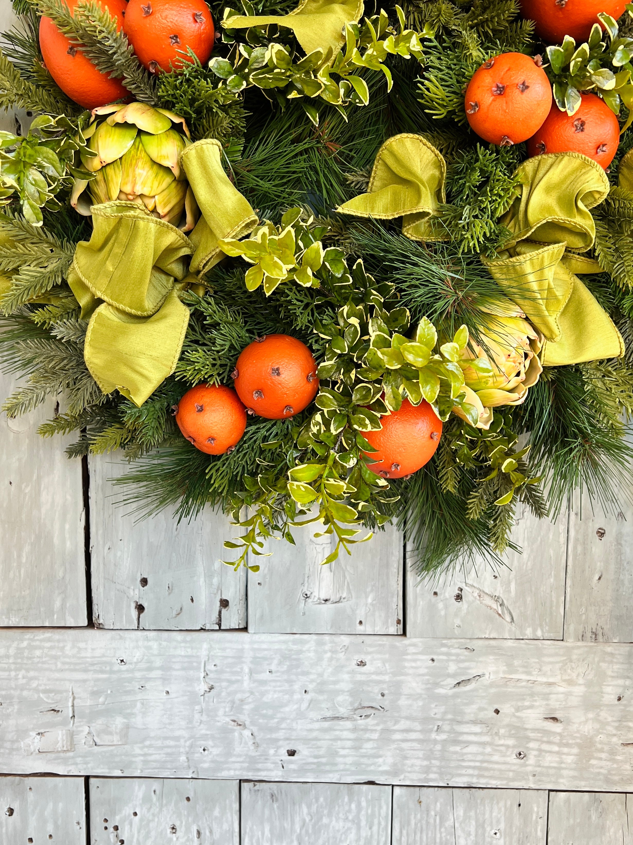 Orange pomander and artichoke wreath