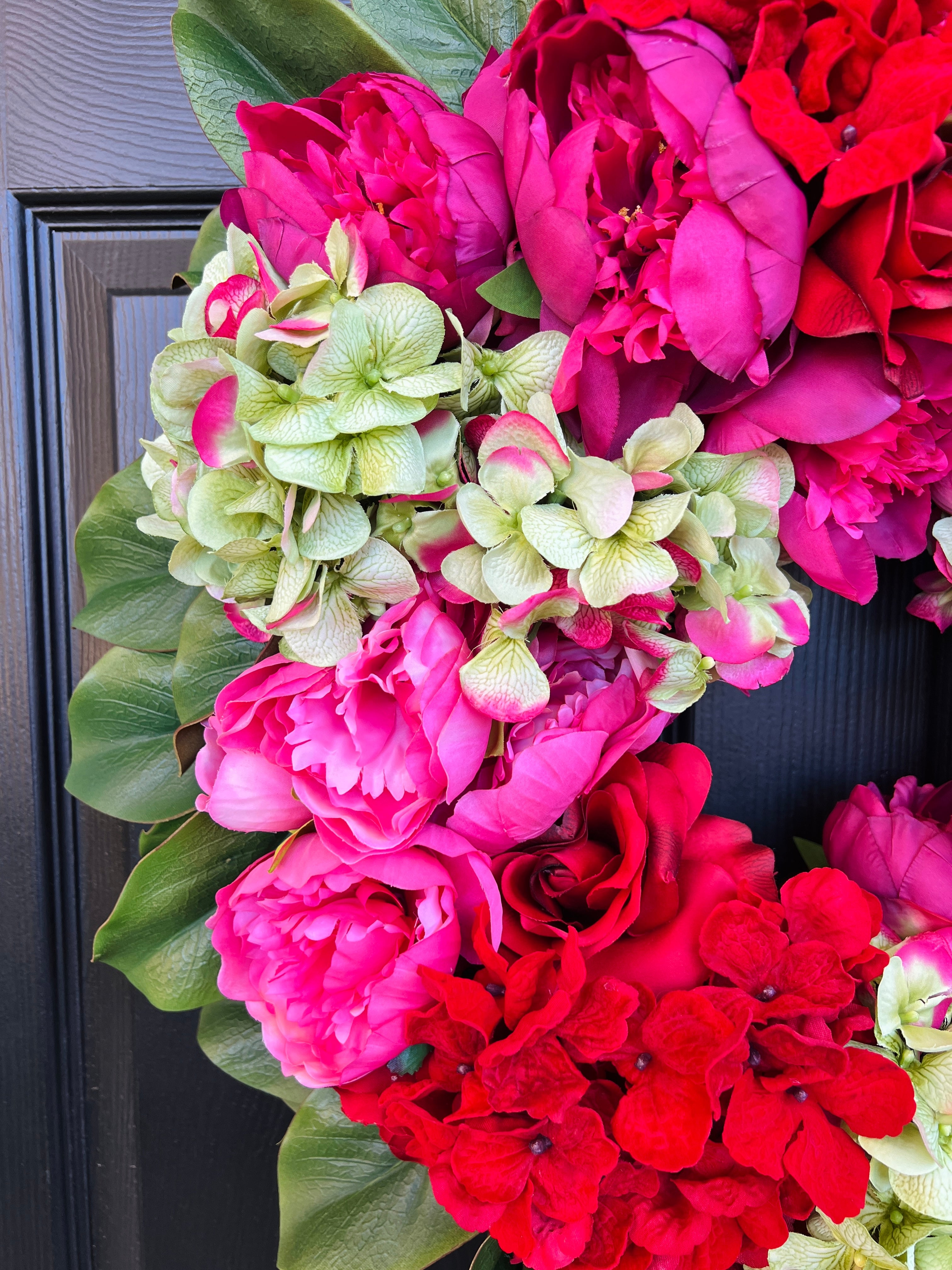 Pink, green, and red floral wreath