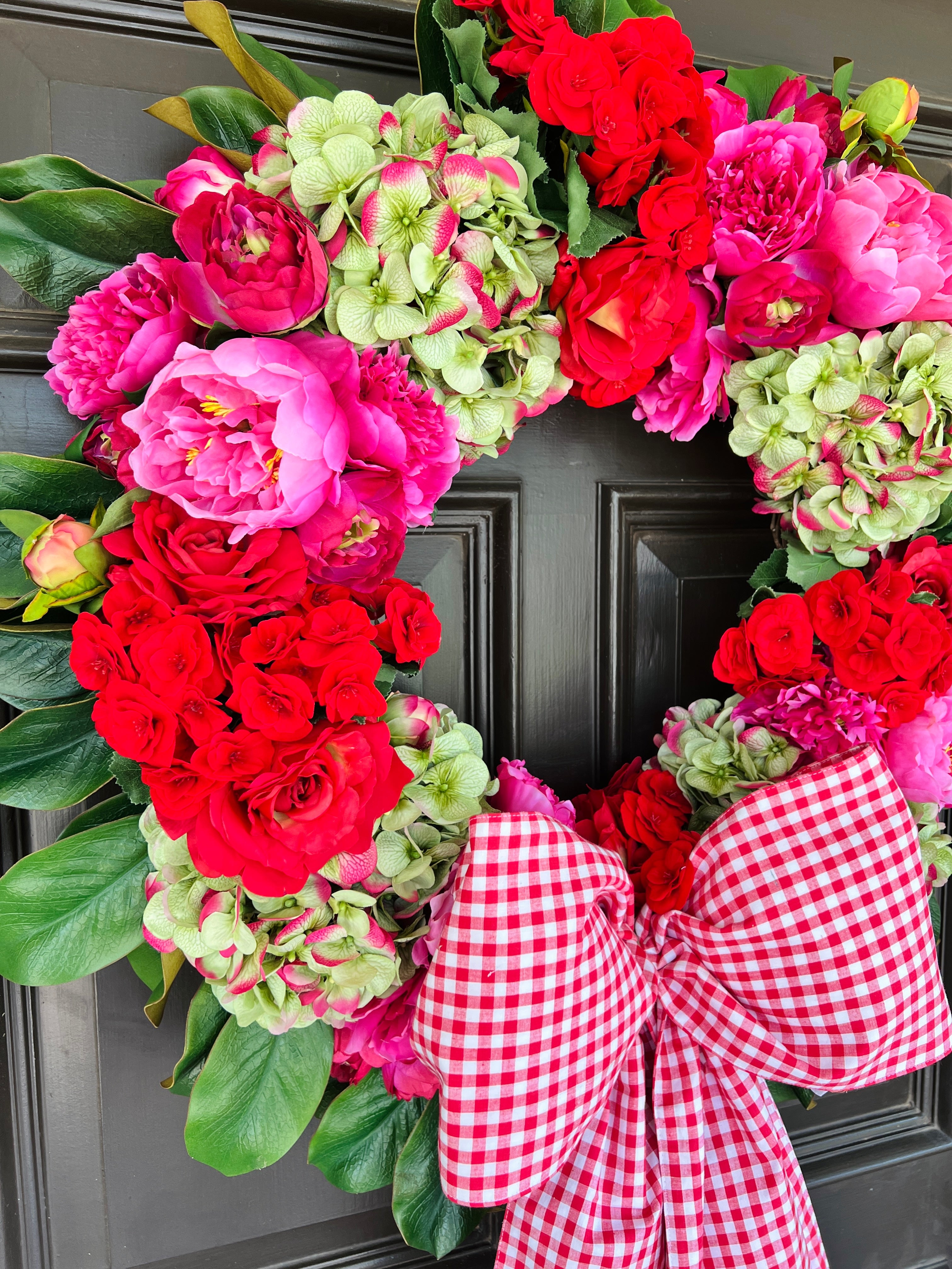 Pink, green, and red floral wreath