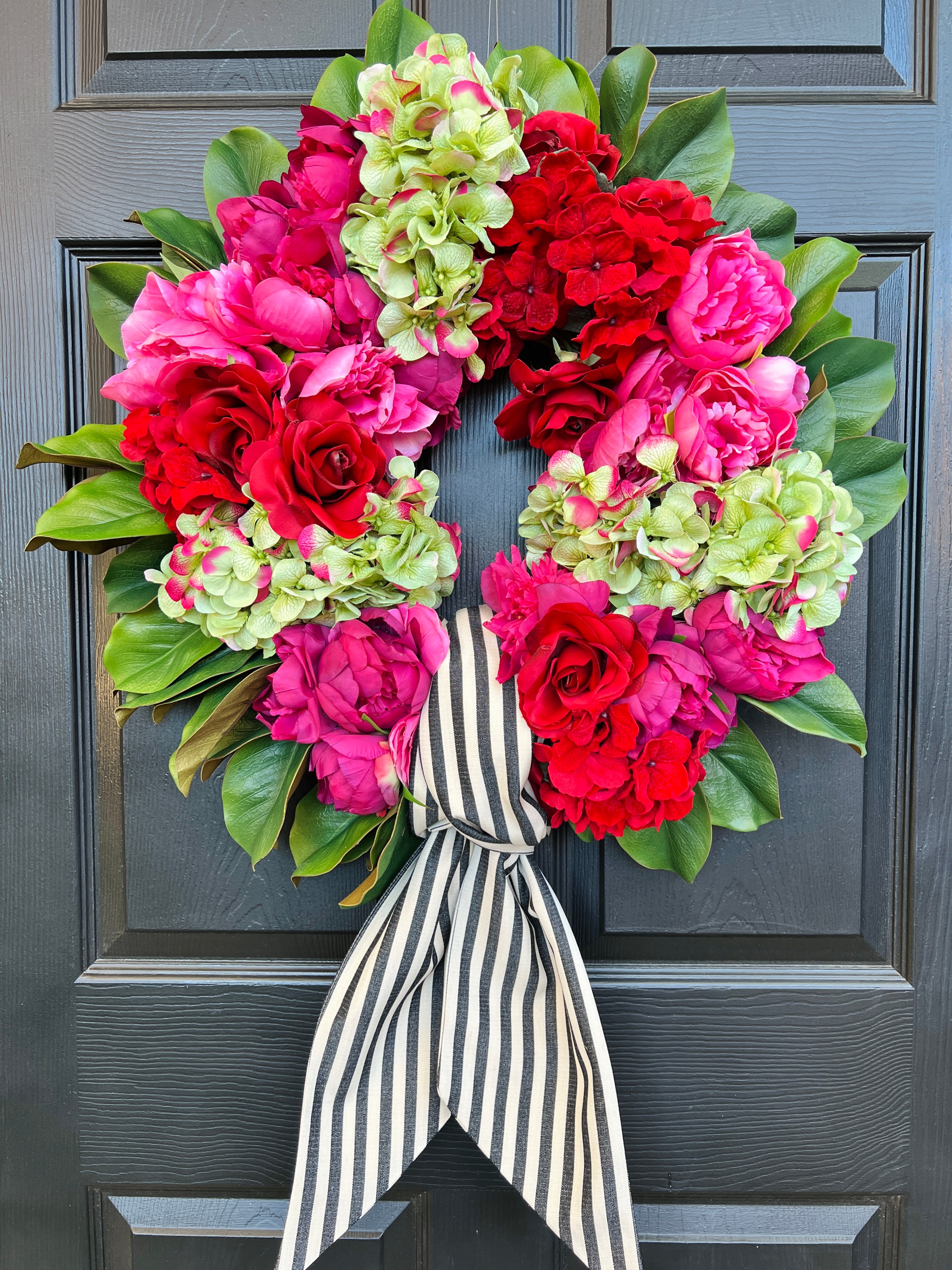 Pink, green, and red floral wreath