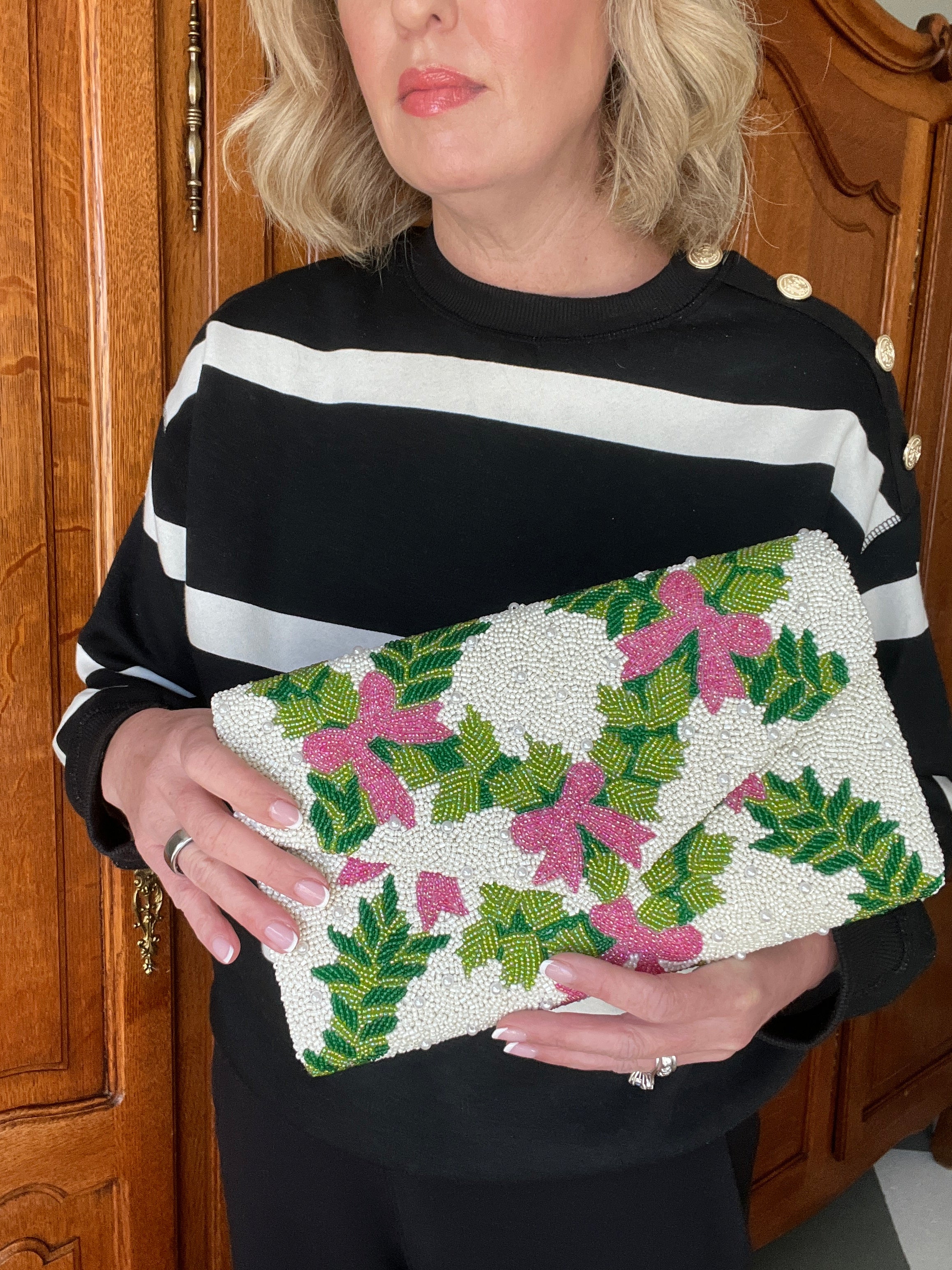 Hand beaded pink bows and green trellis clutch