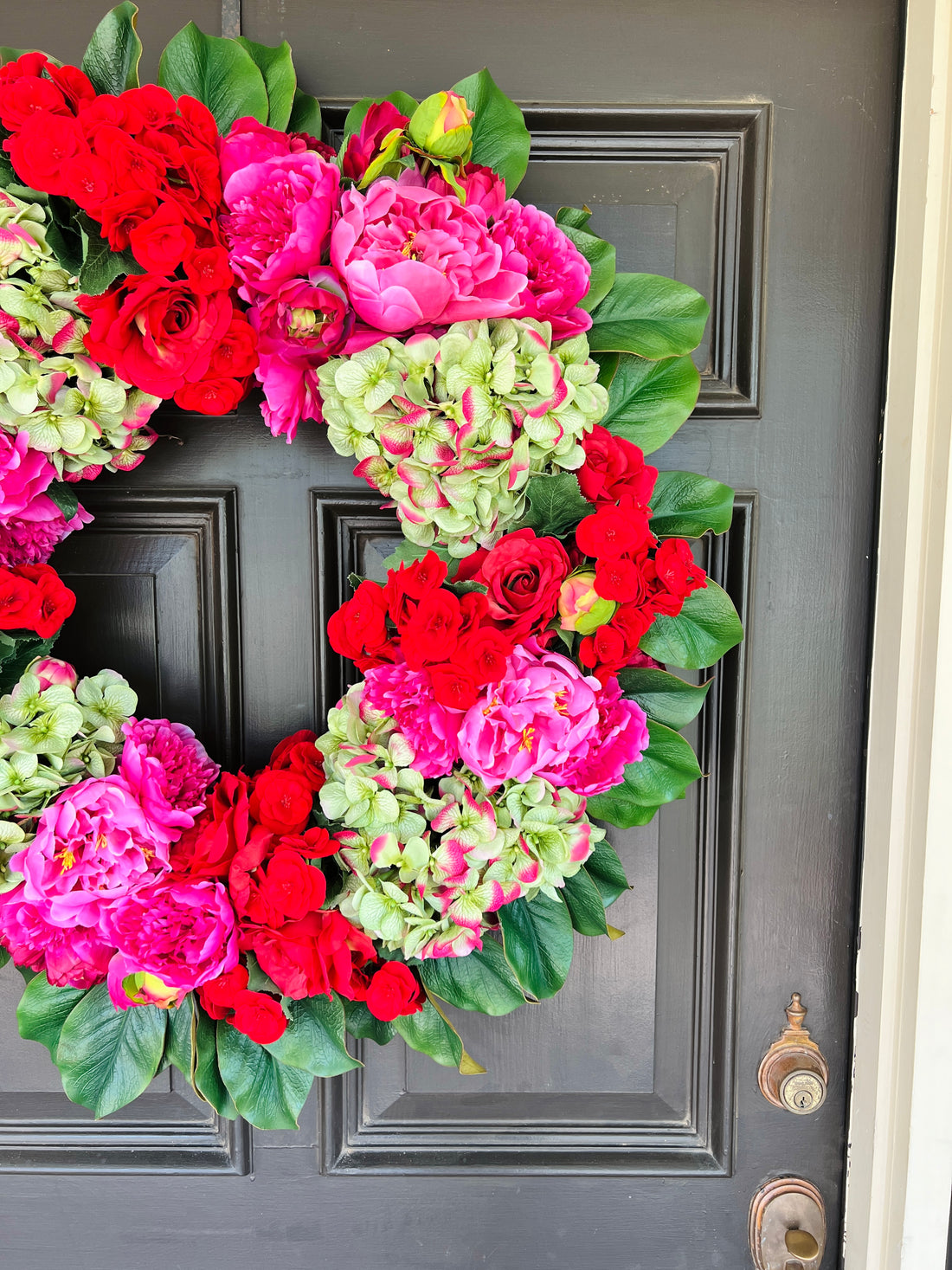 Pink, green, and red floral wreath