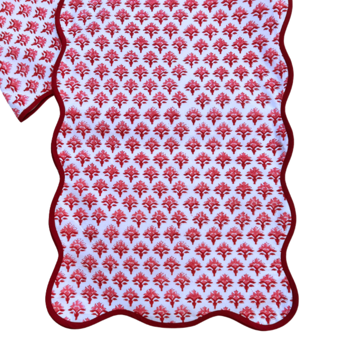 Red block print scalloped table runner with contrast piping
