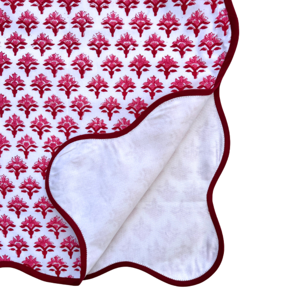 Red block print scalloped table runner with contrast piping