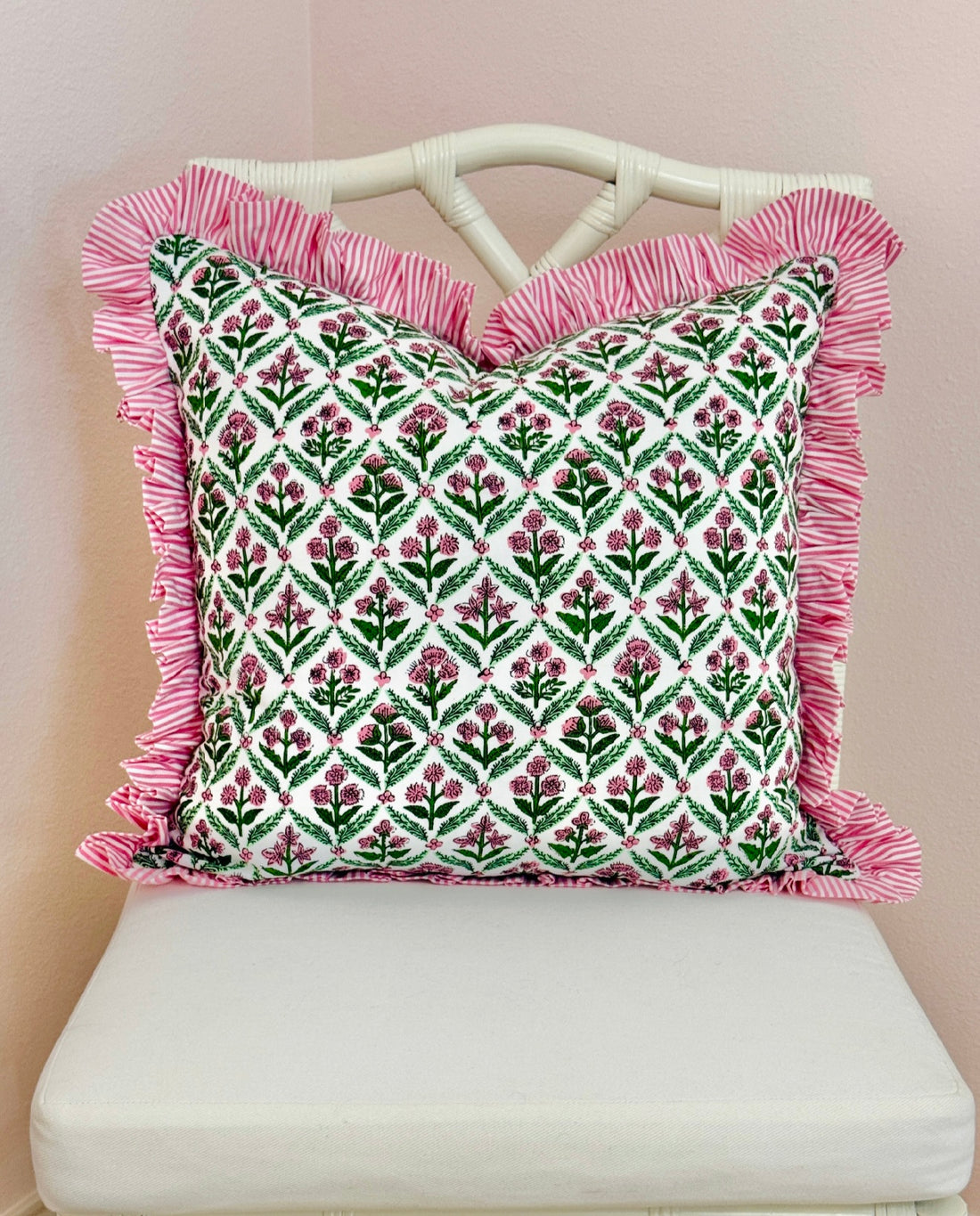 Pink and green floral trellis block print ruffle pillow cover with pink striped trim and back
