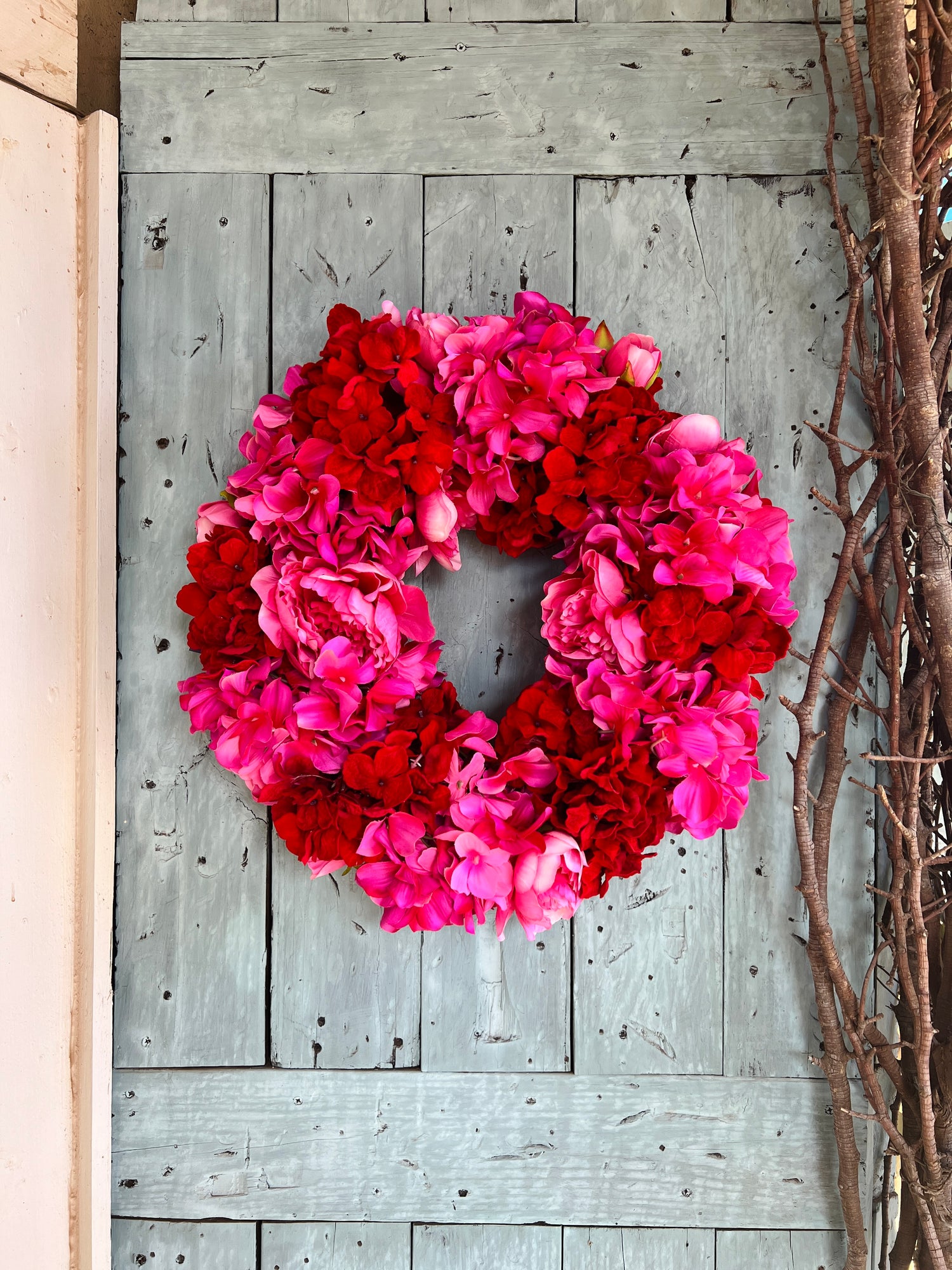 Pink and red hydrangea and peony floral wreath