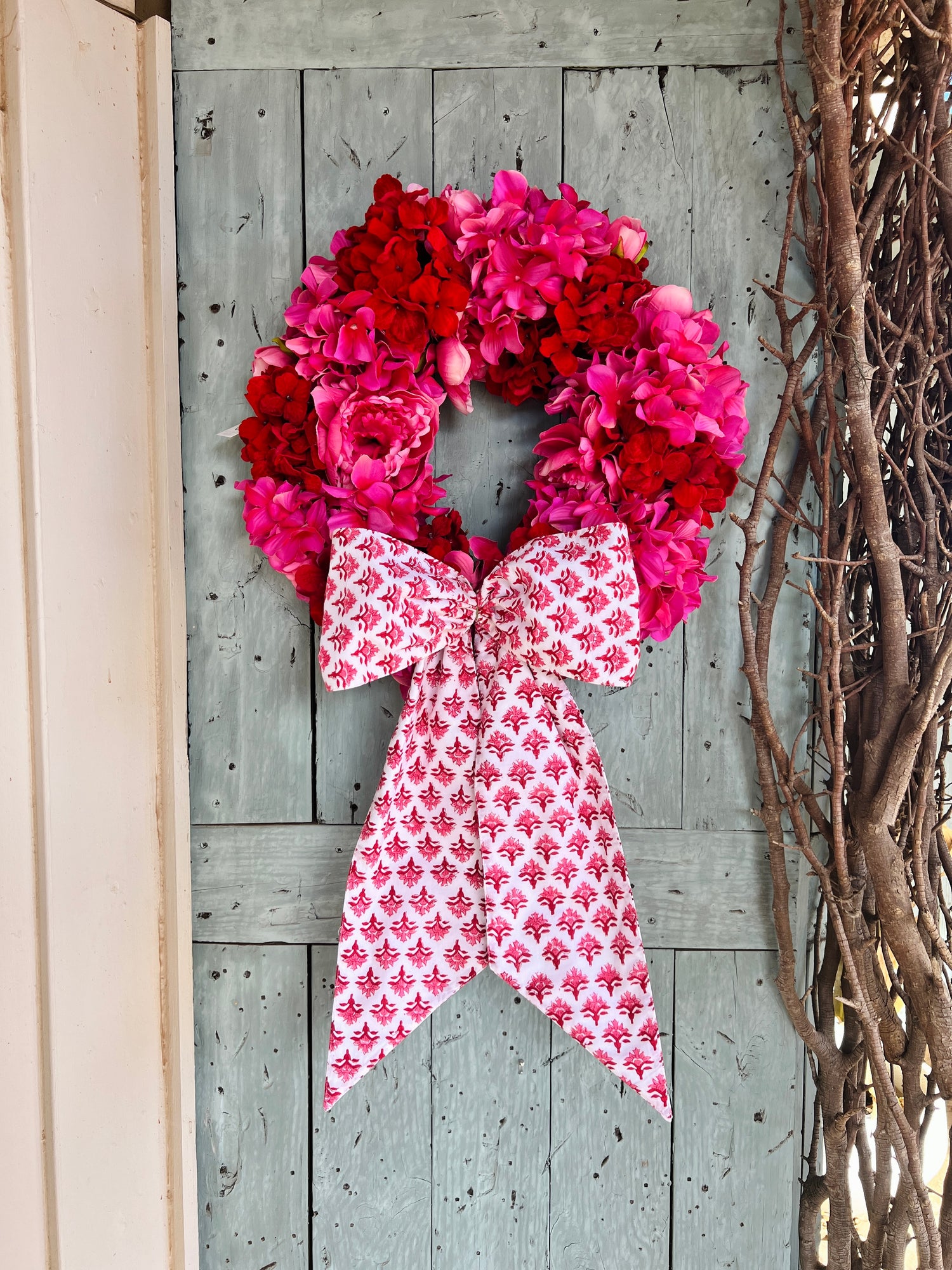 Pink and red hydrangea and peony floral wreath