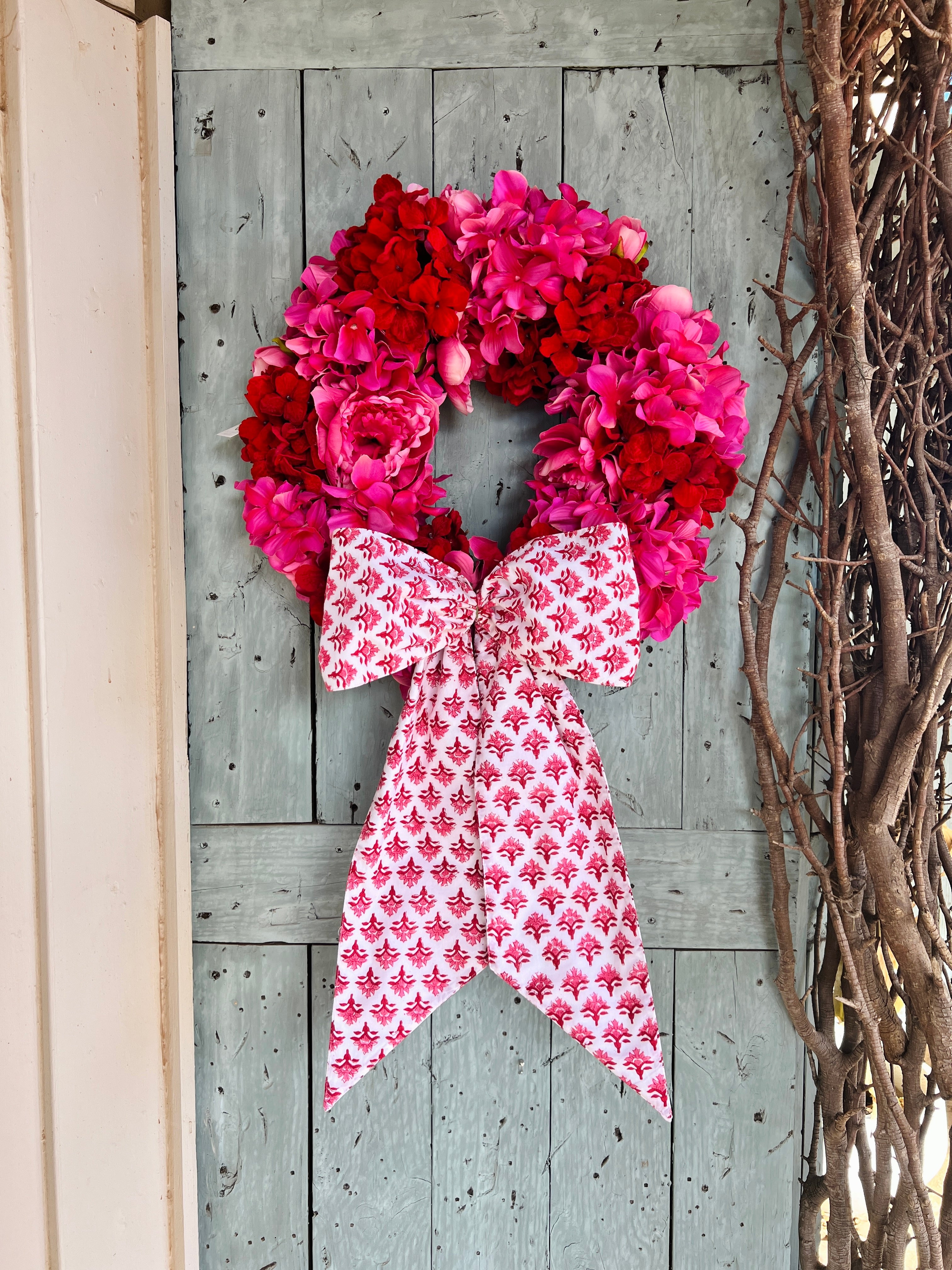 Pink and red hydrangea and peony floral wreath