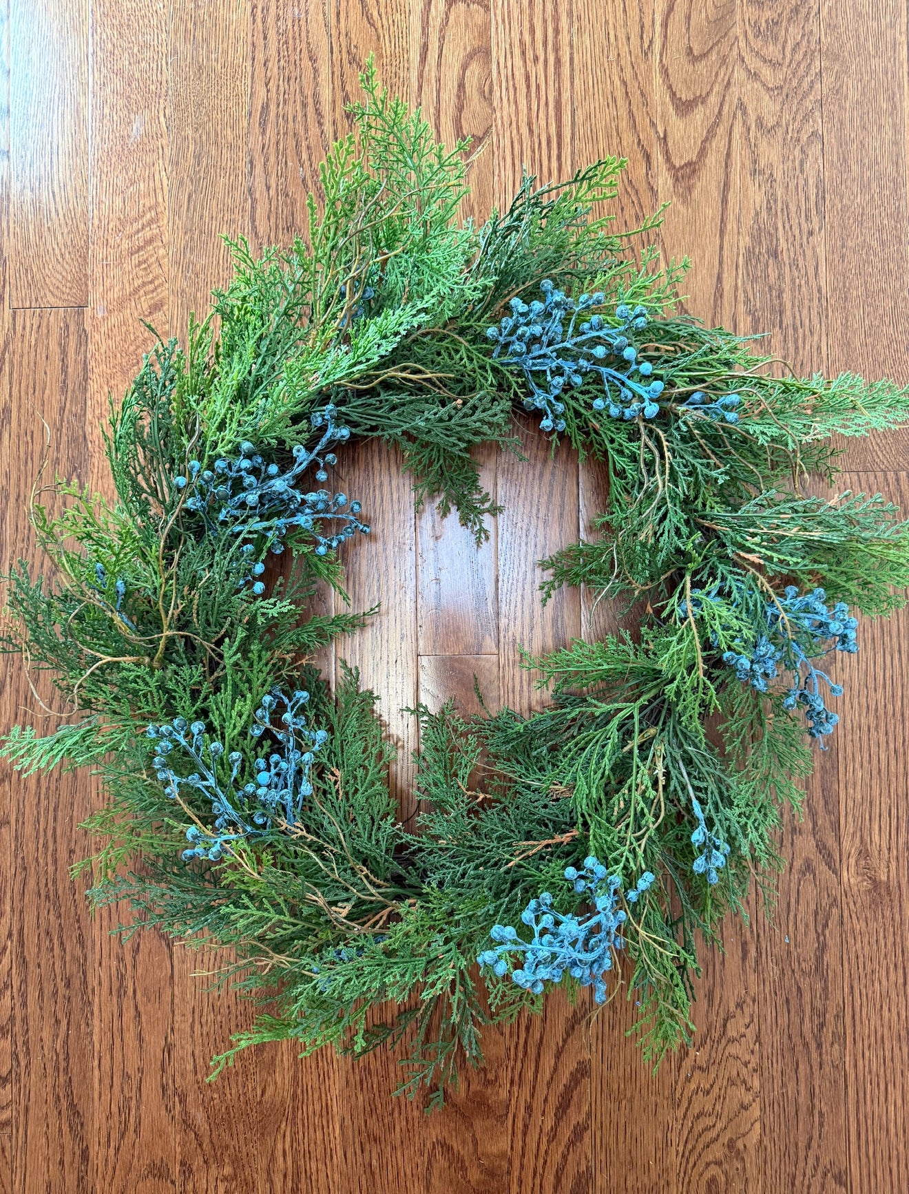 Fresh looking faux juniper wreath 22”