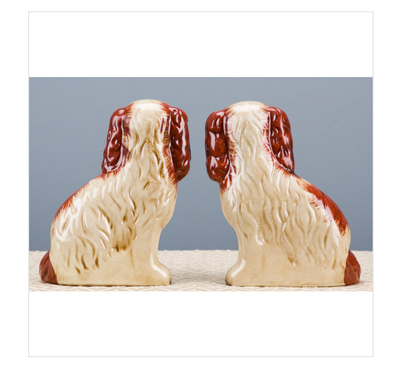 Staffordshire dog pair with flower baskets- rust