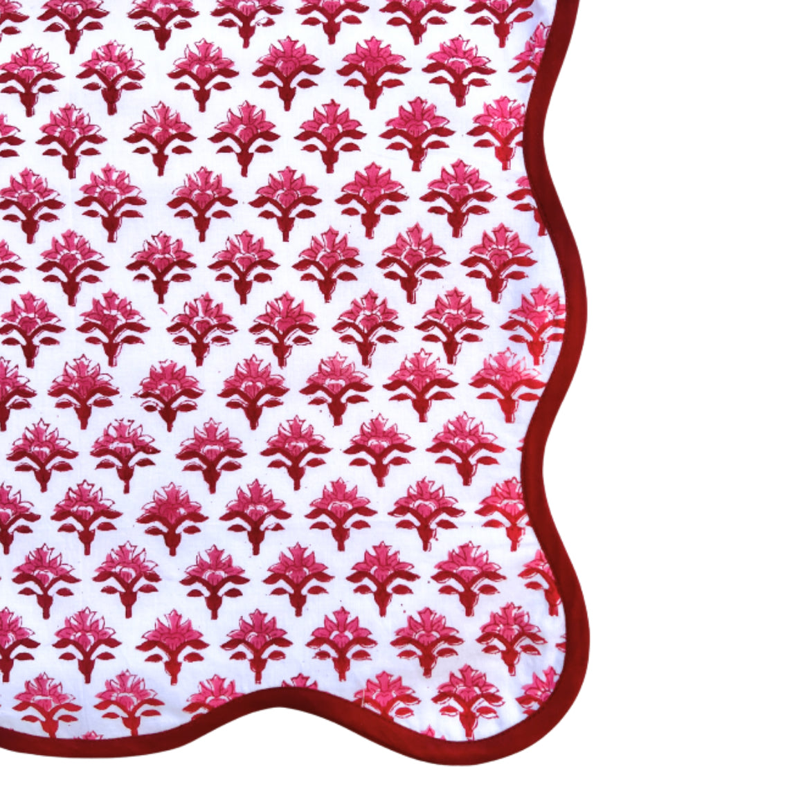 Red block print scalloped table runner with contrast piping