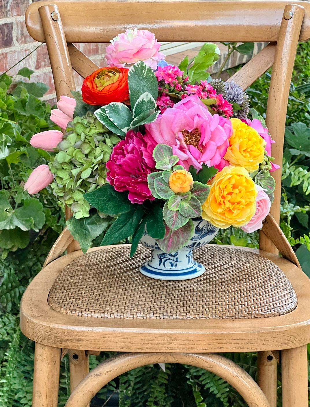 Bright mixed floral arrangement in chinoiserie footed bowl