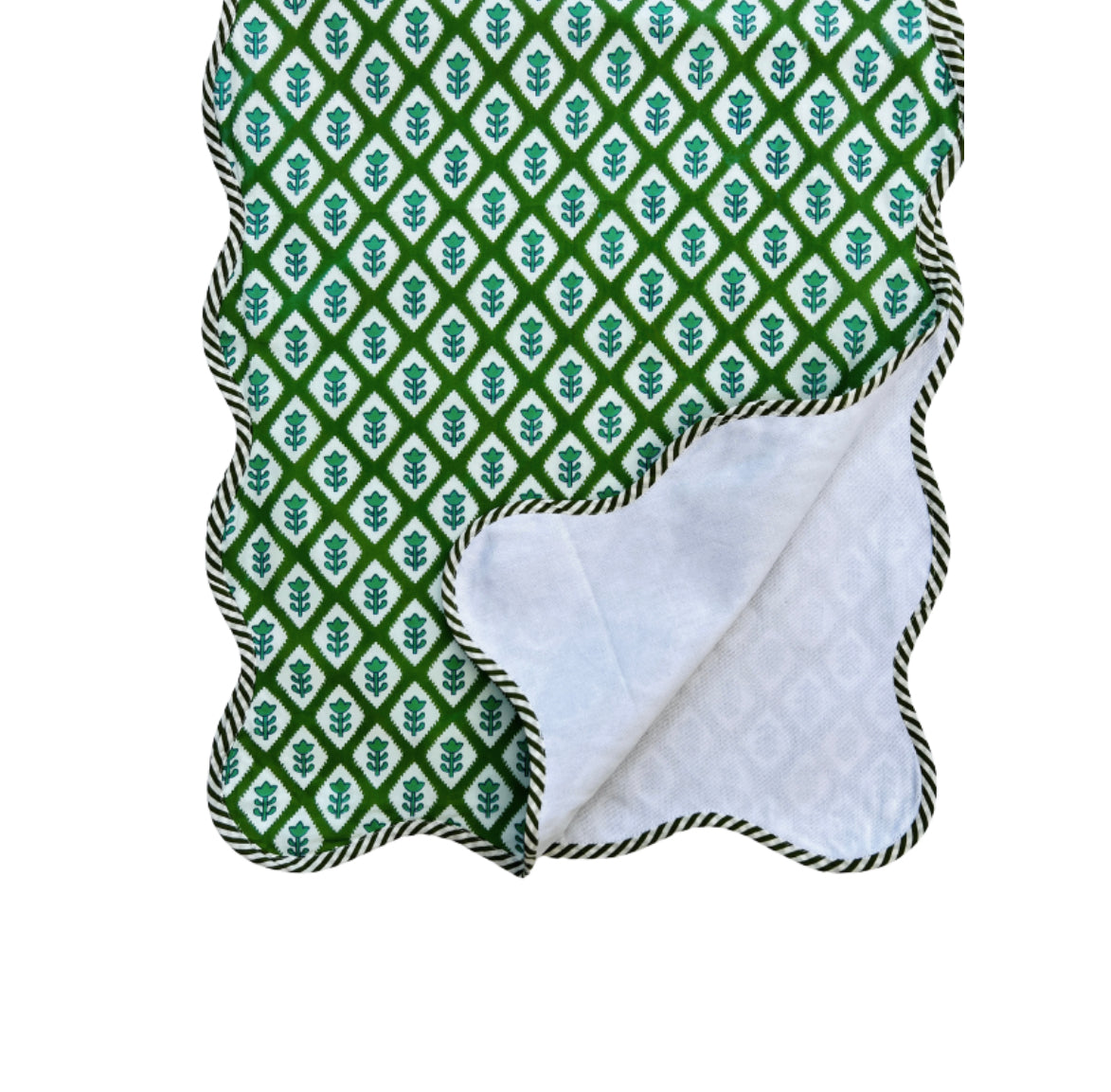 Green block print scalloped table runner with contrast piping