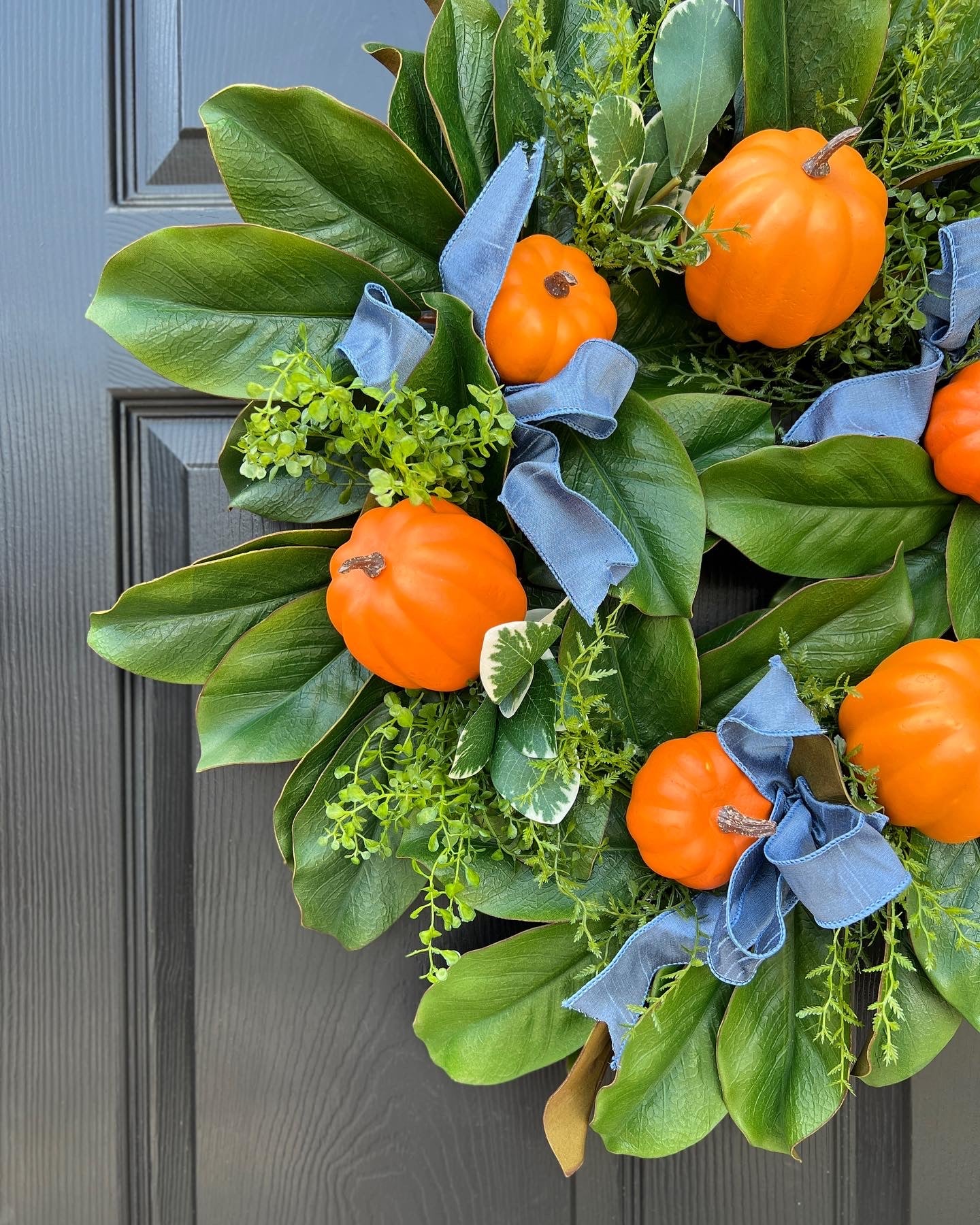 Fall orange pumpkin and magnolia wreath with French blue ribbons