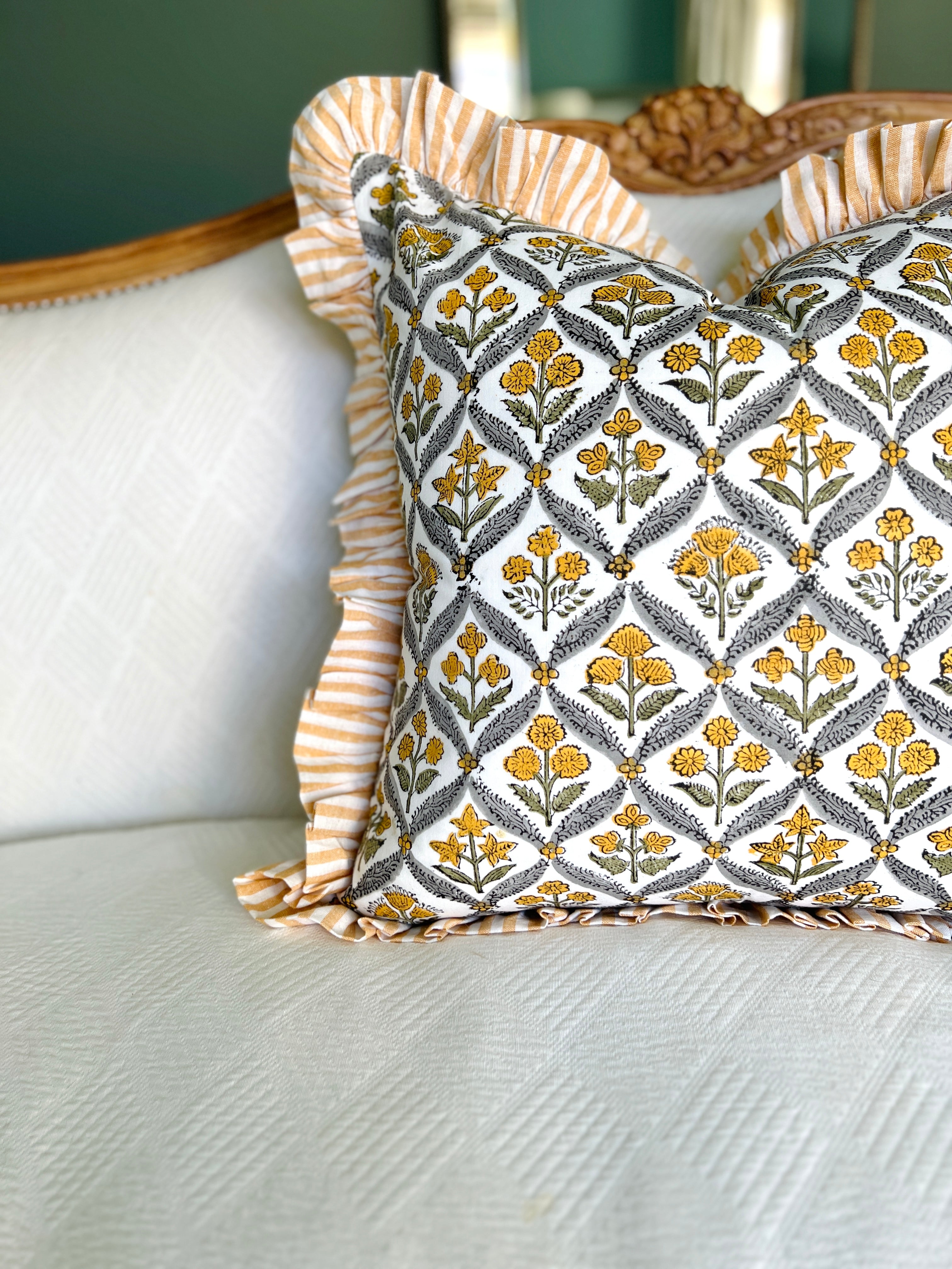Yellow block print pillow cover with ruffle trim