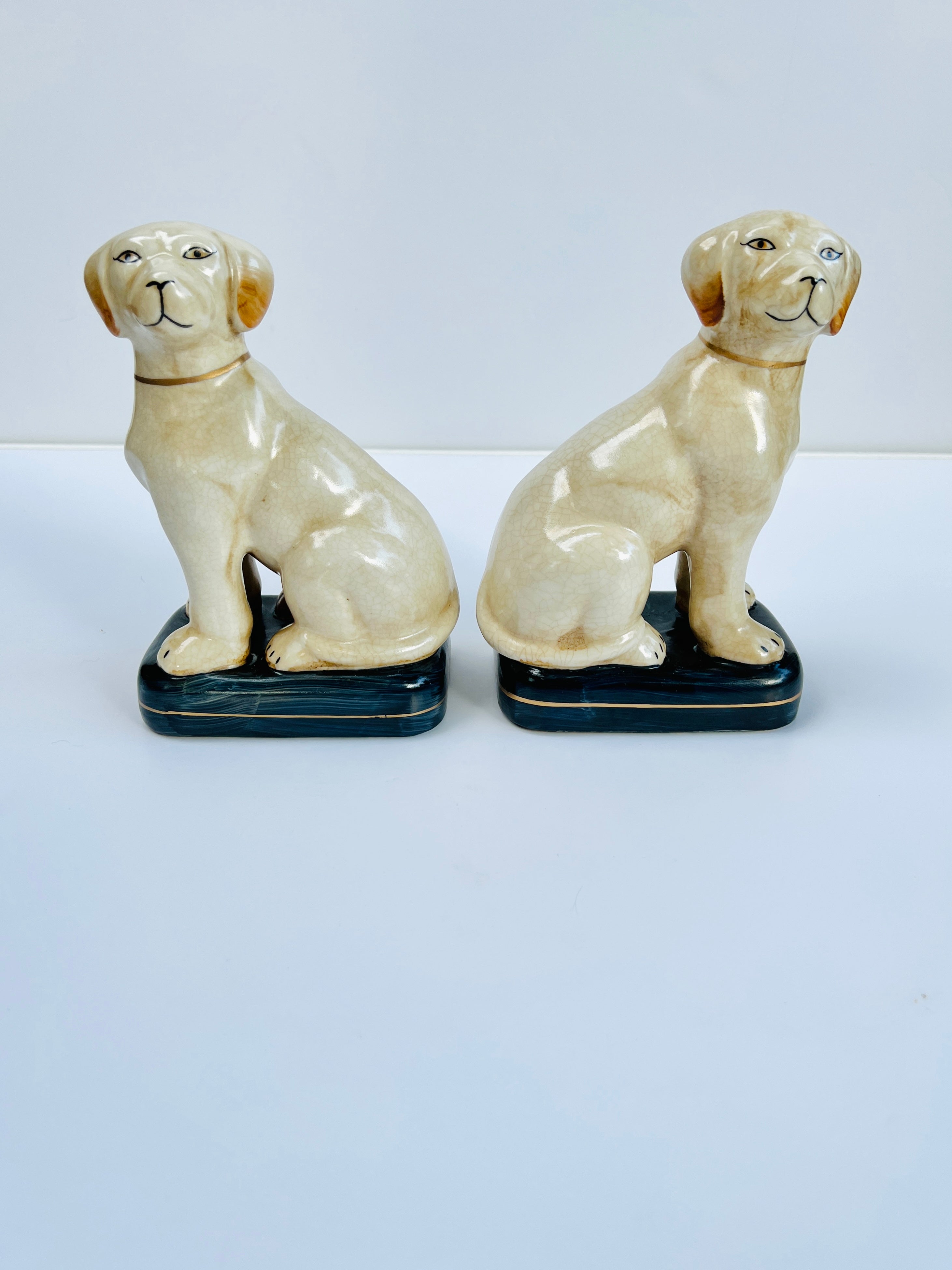 White Staffordshire dog pair on cushions