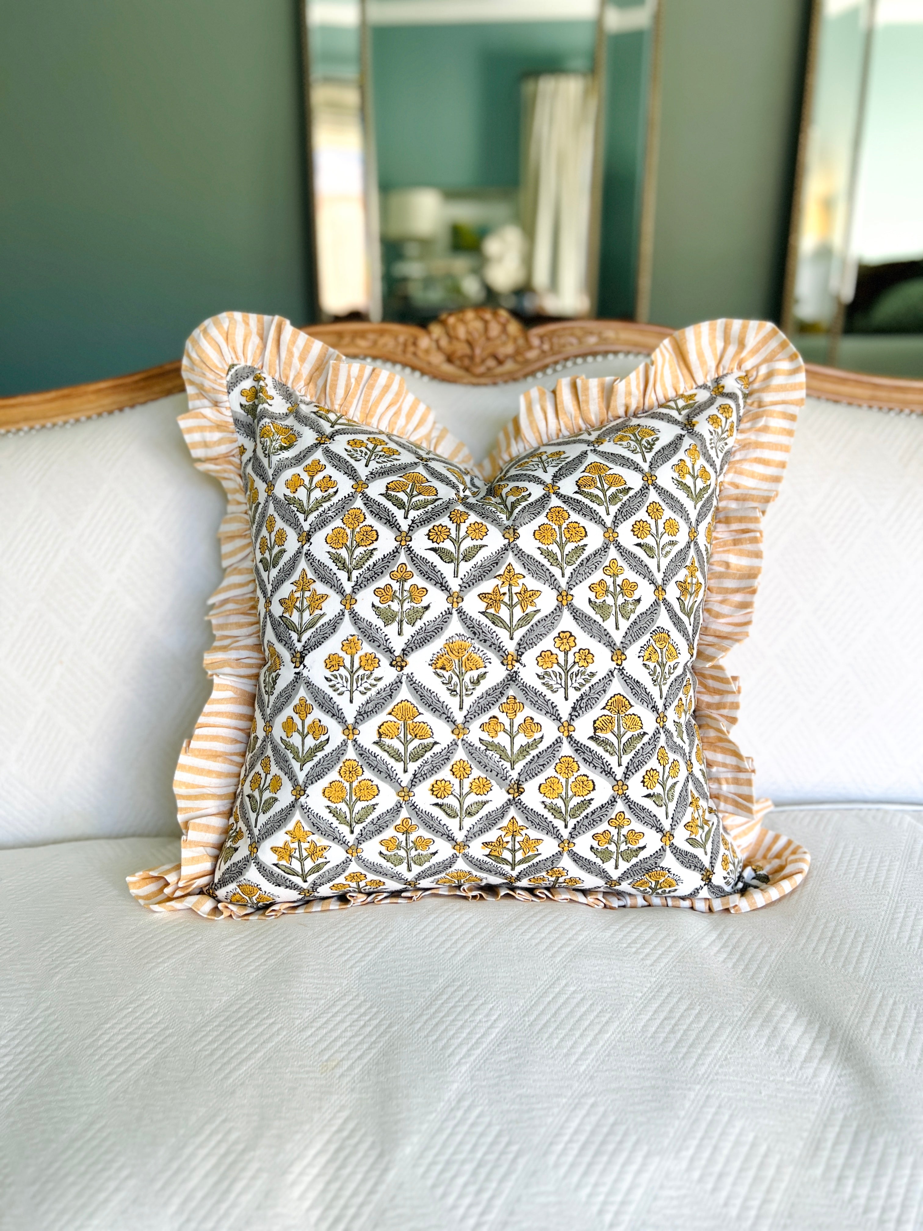 Yellow block print pillow cover with ruffle trim