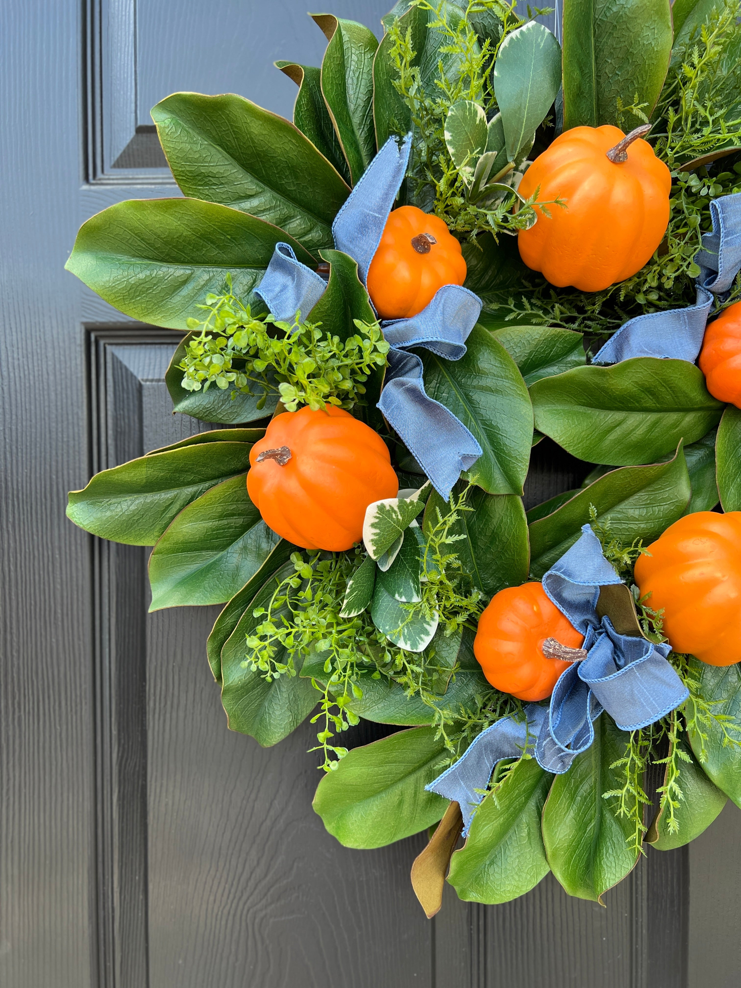 Fall orange pumpkin and magnolia wreath with French blue ribbons