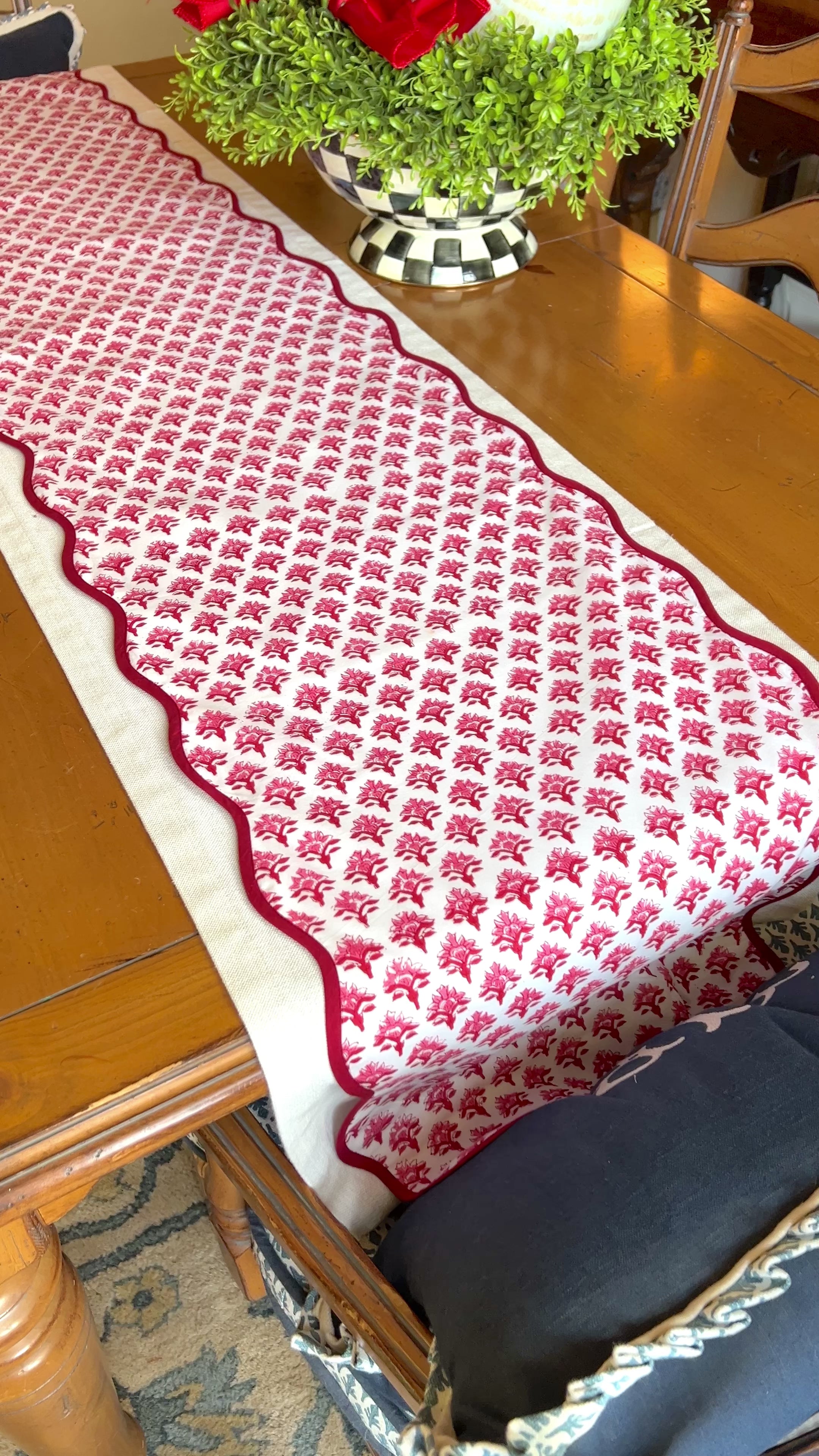 Red block print scalloped table runner with contrast piping