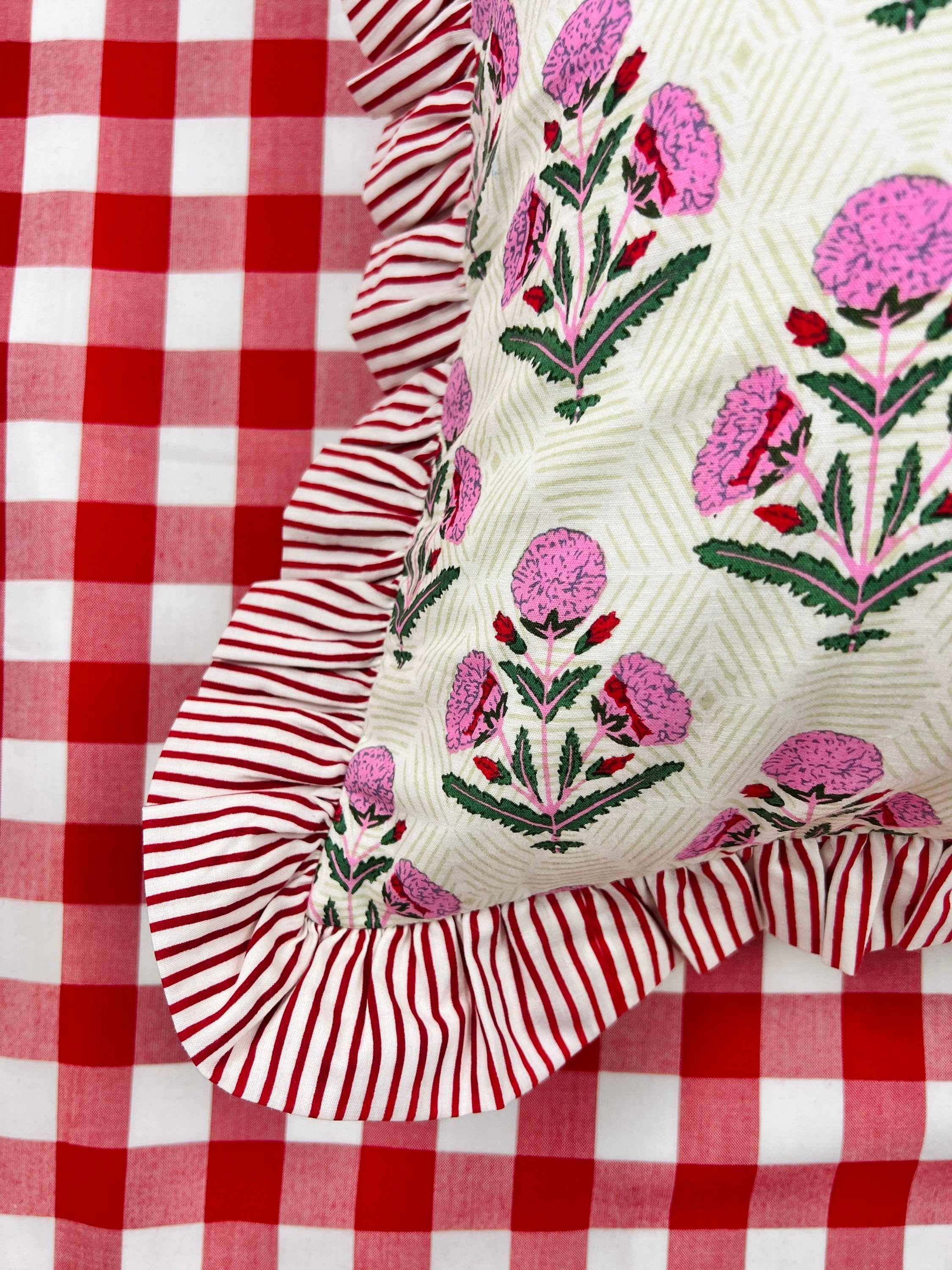 Pink and red floral block print ruffle pillow