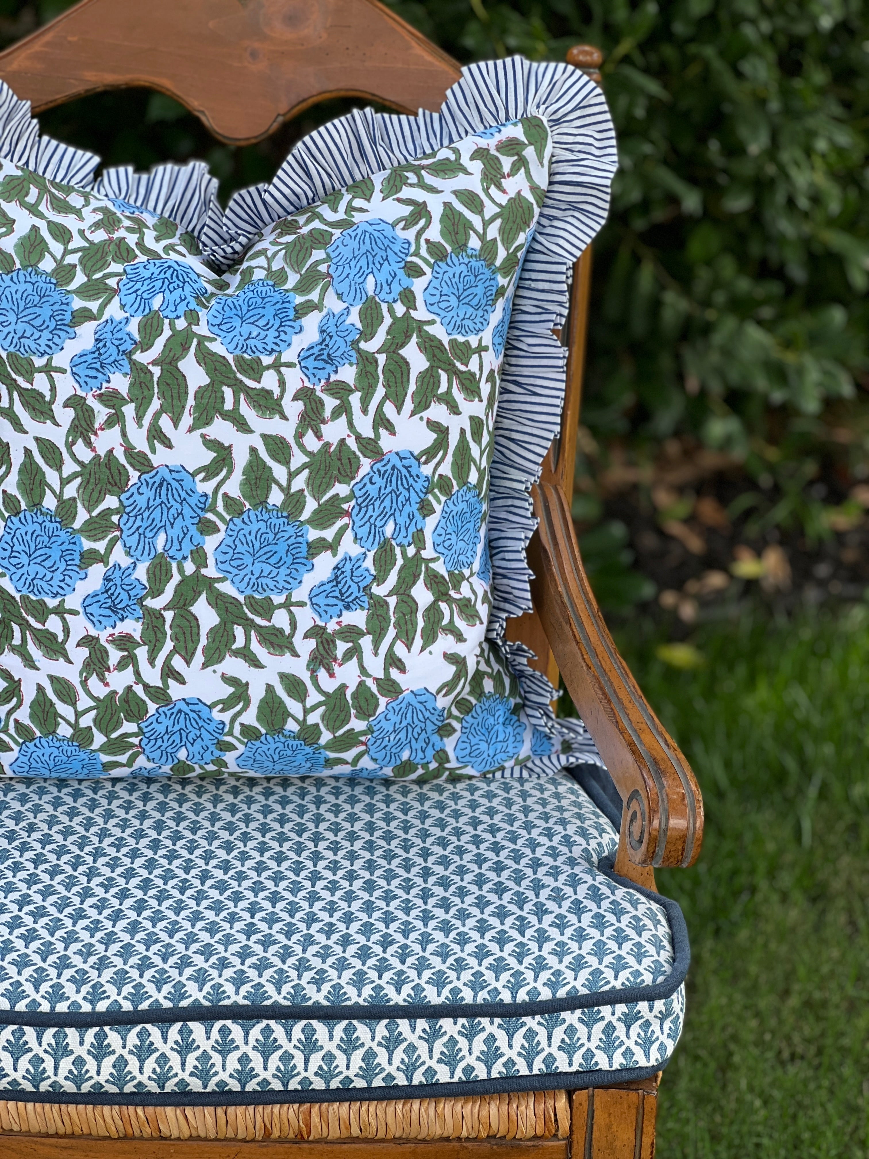 Blue and green floral block print pillow cover with ruffle trim