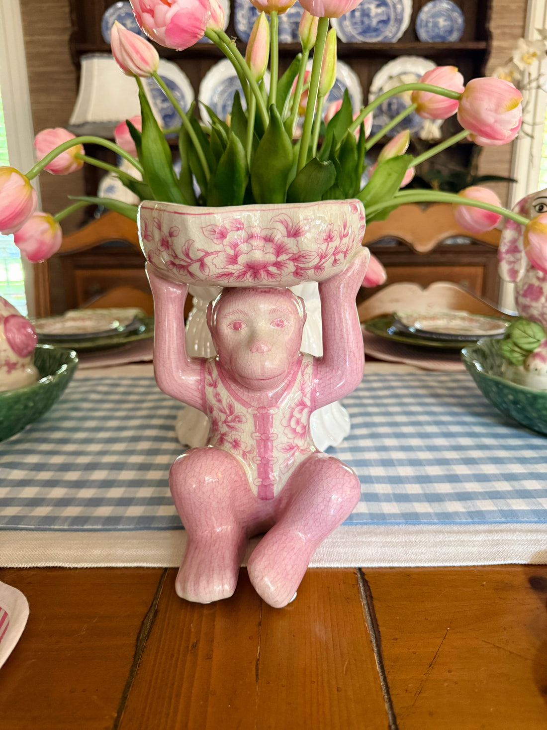 Pink porcelain chinoiserie monkey with lotus bowl
