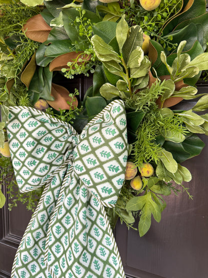 Green block print wreath sash with striped piping
