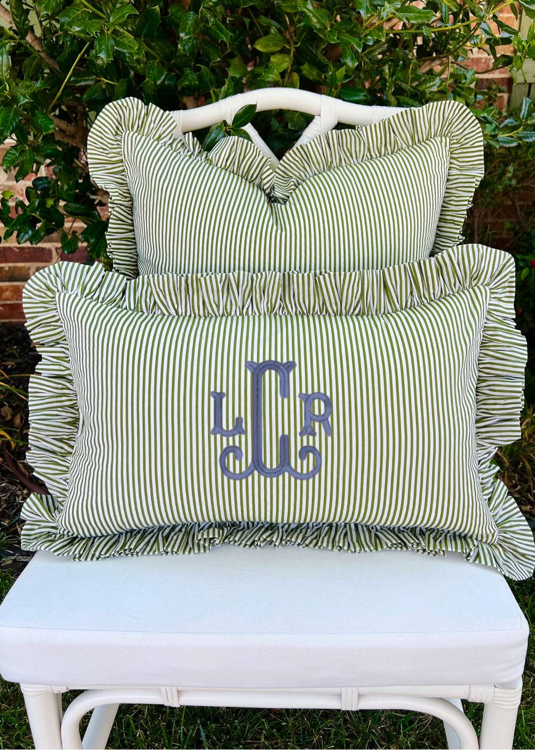 Green and off white striped pillow cover with ruffle trim