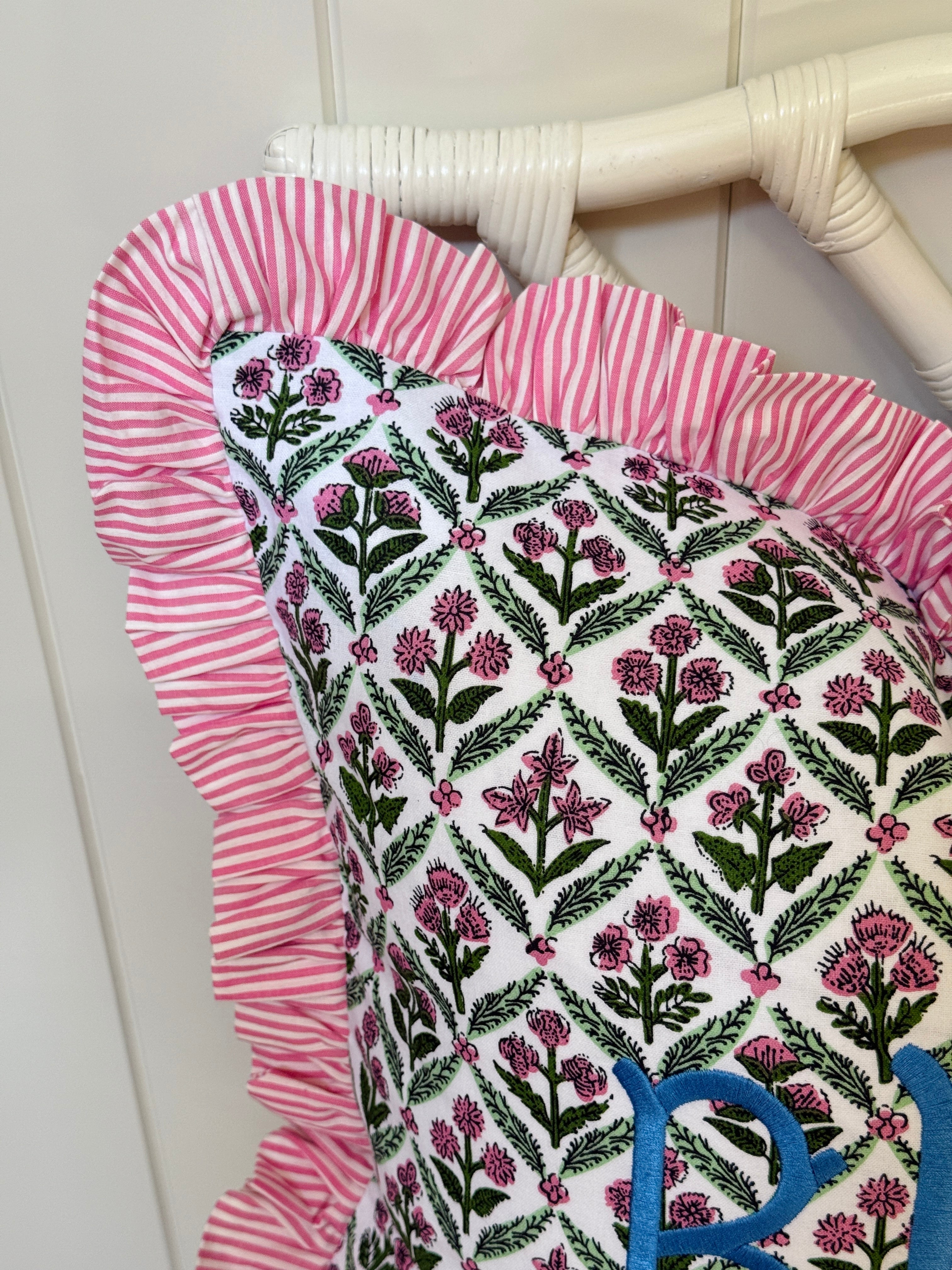 Pink and green floral trellis block print ruffle pillow cover with pink striped ruffle trim