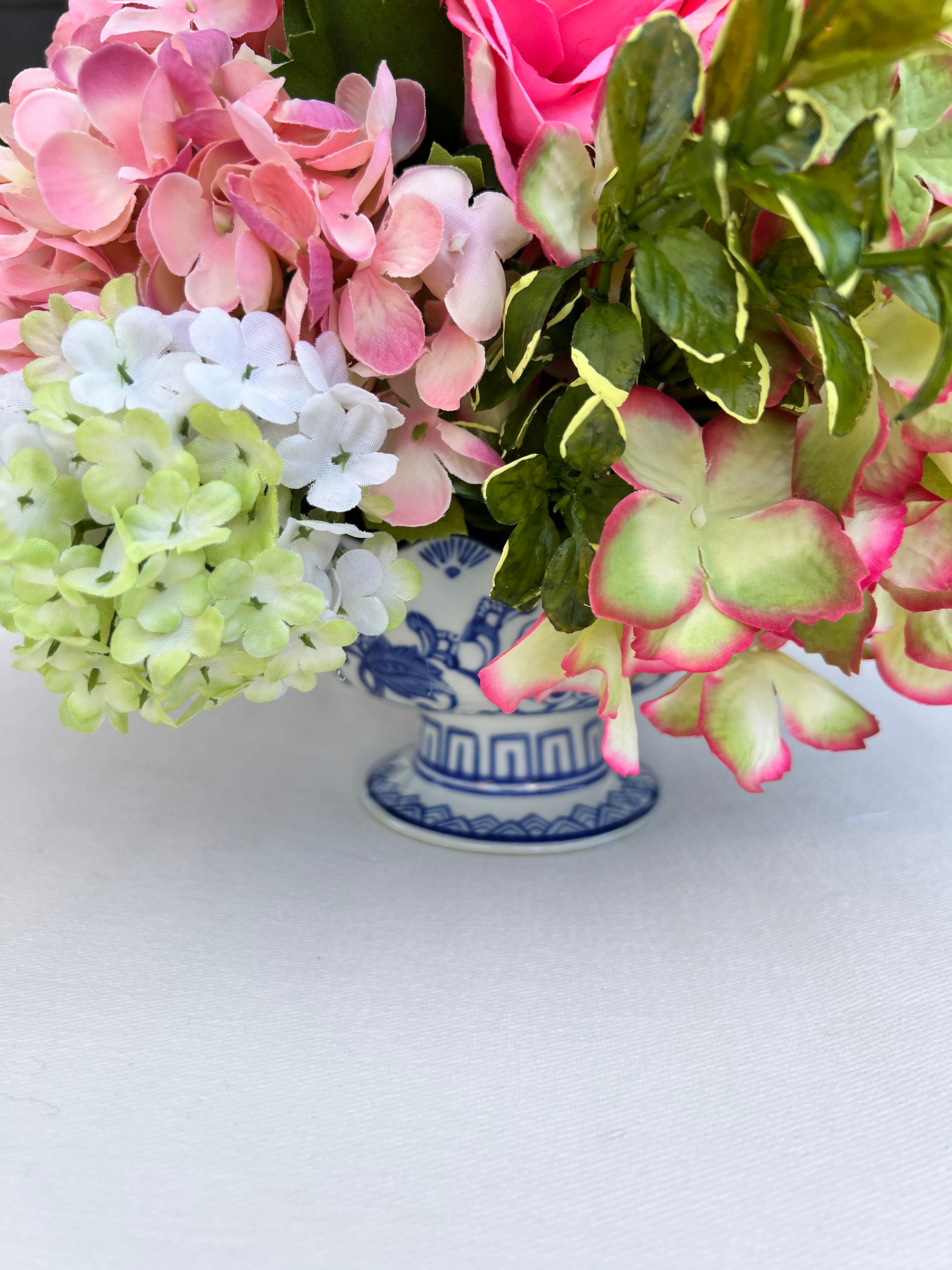 Pink and green Spring floral arrangement in chinoiserie footed bowl