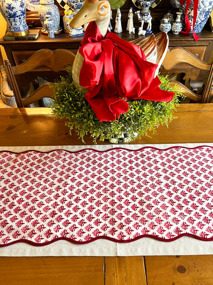 Red block print scalloped table runner with contrast piping