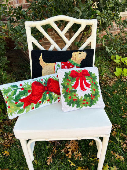 Red bow and greenery hand hooked lumbar pillow