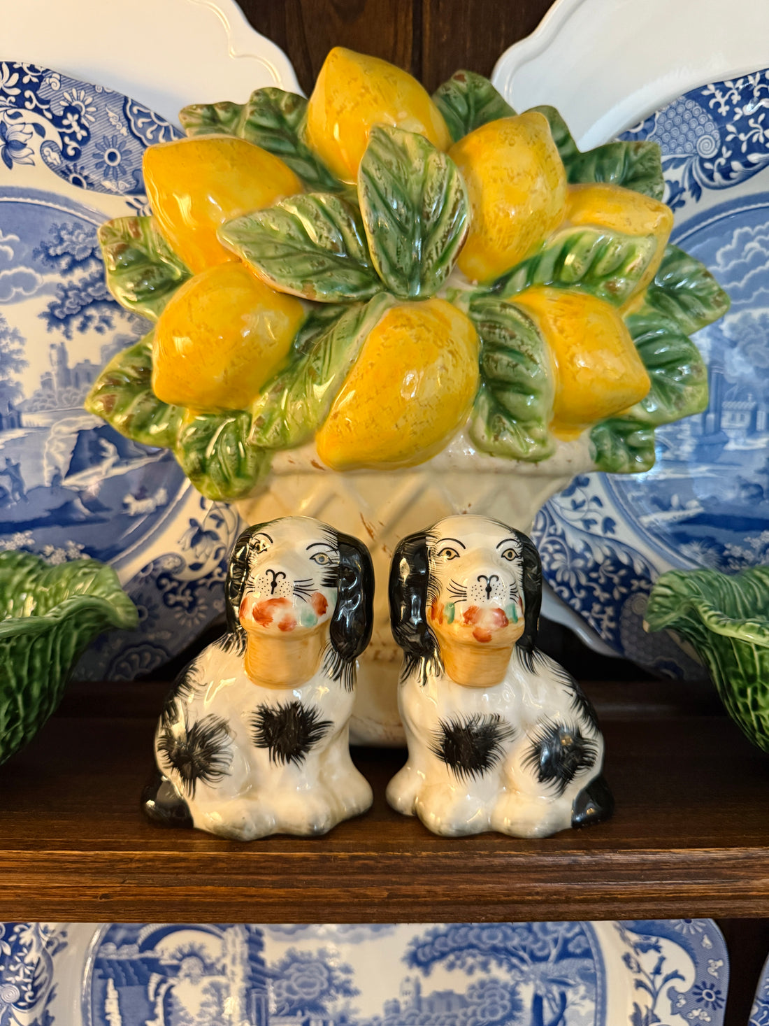 Mini black porcelain Staffordshire dogs with flower baskets figurine pair