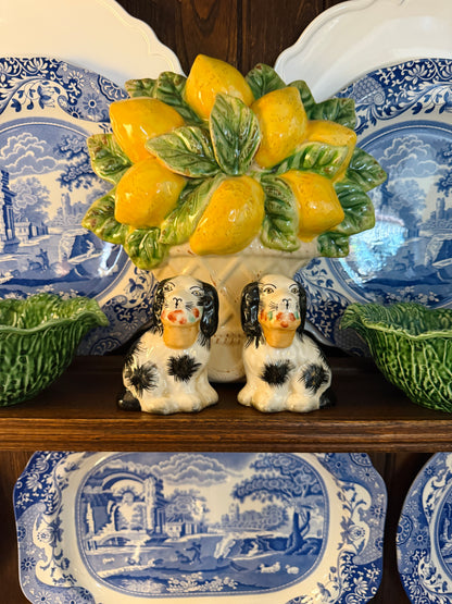 Mini black porcelain Staffordshire dogs with flower baskets figurine pair