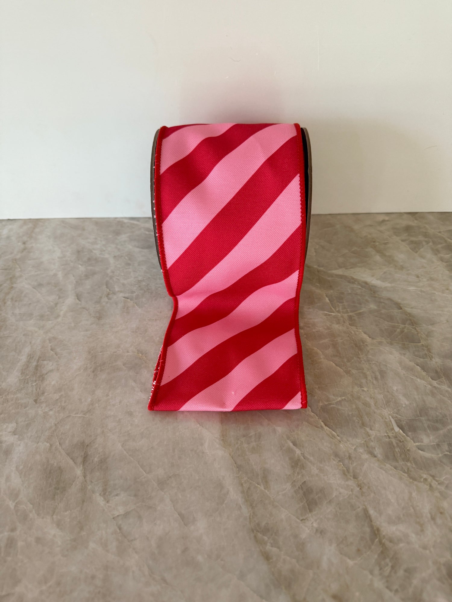 Pink and red diagonal striped ribbon by the roll, 4”x10 yards